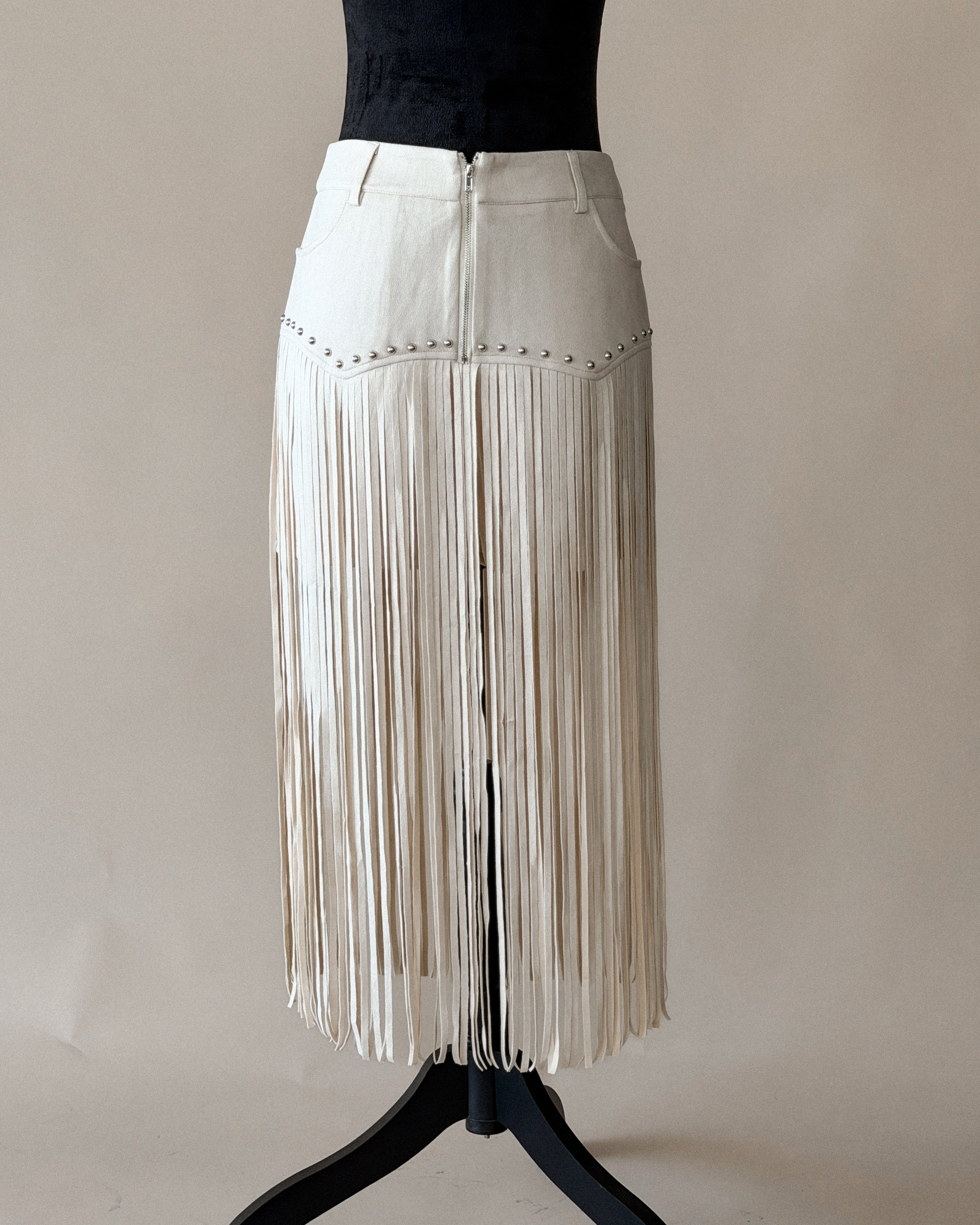 Thunderbird pendant chain necklace displayed on wooden slab with serape fabric underneath - The Wild J