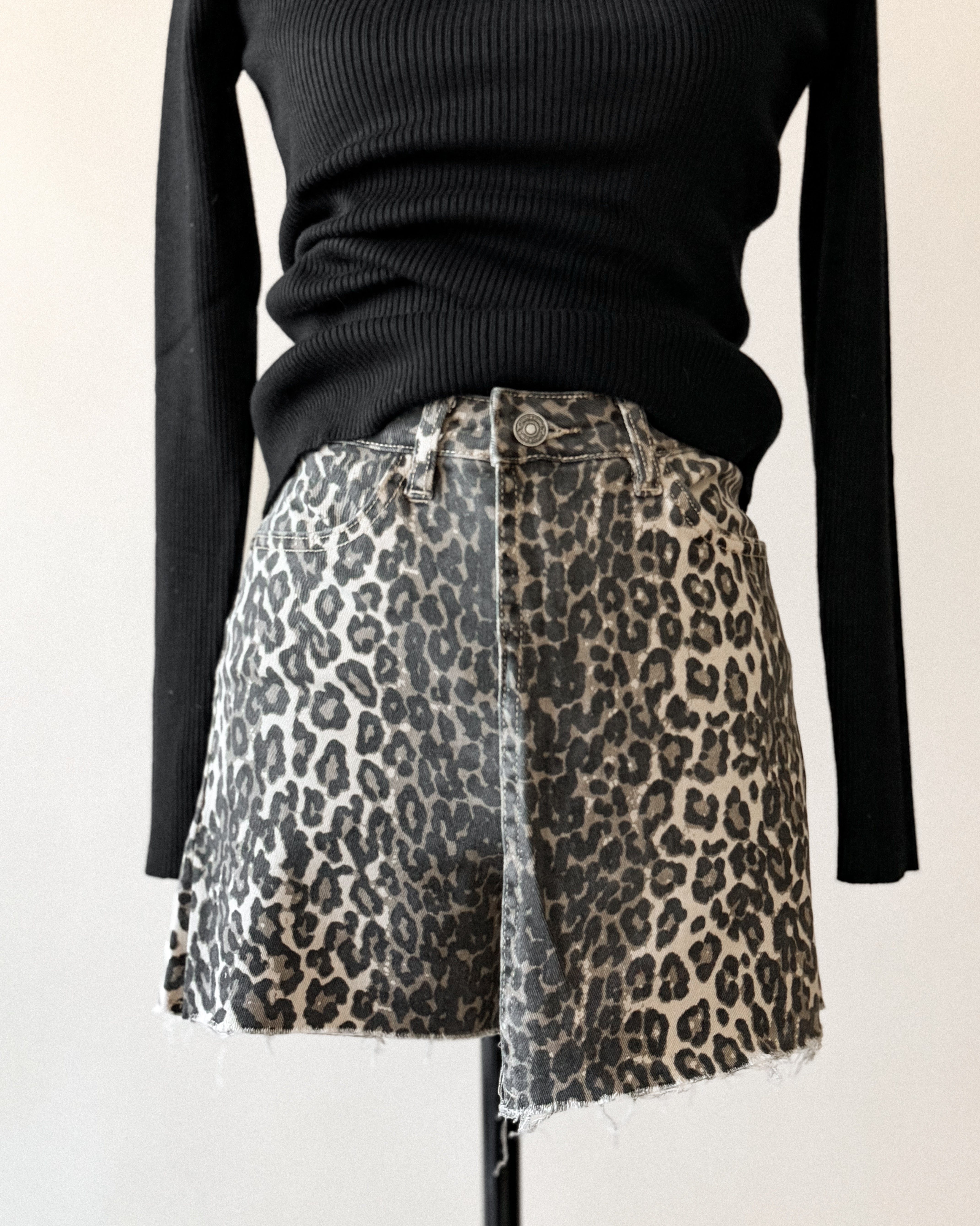 Thunderbird pendant chain necklace displayed on wooden slab with serape fabric underneath - The Wild J