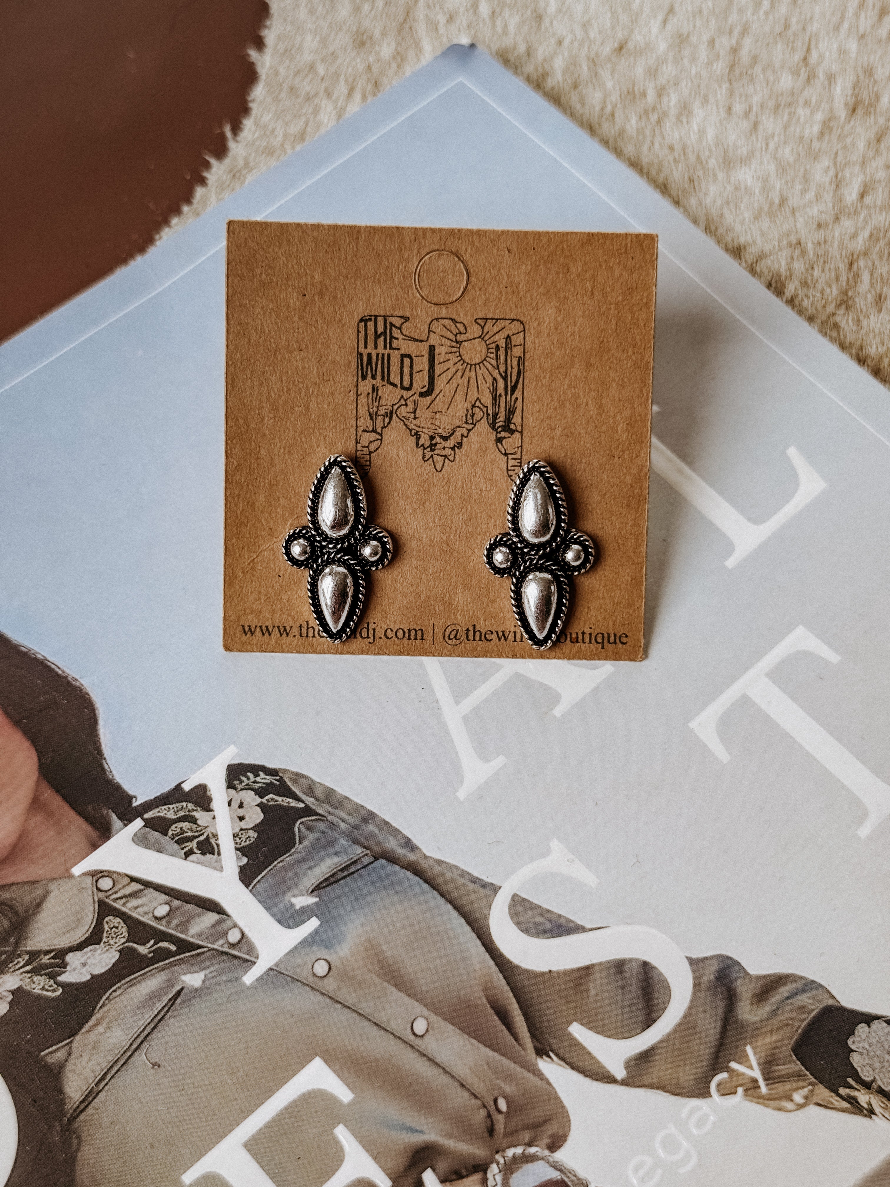 Burnished silver shield-shaped stud earrings featuring bubble accent detailing