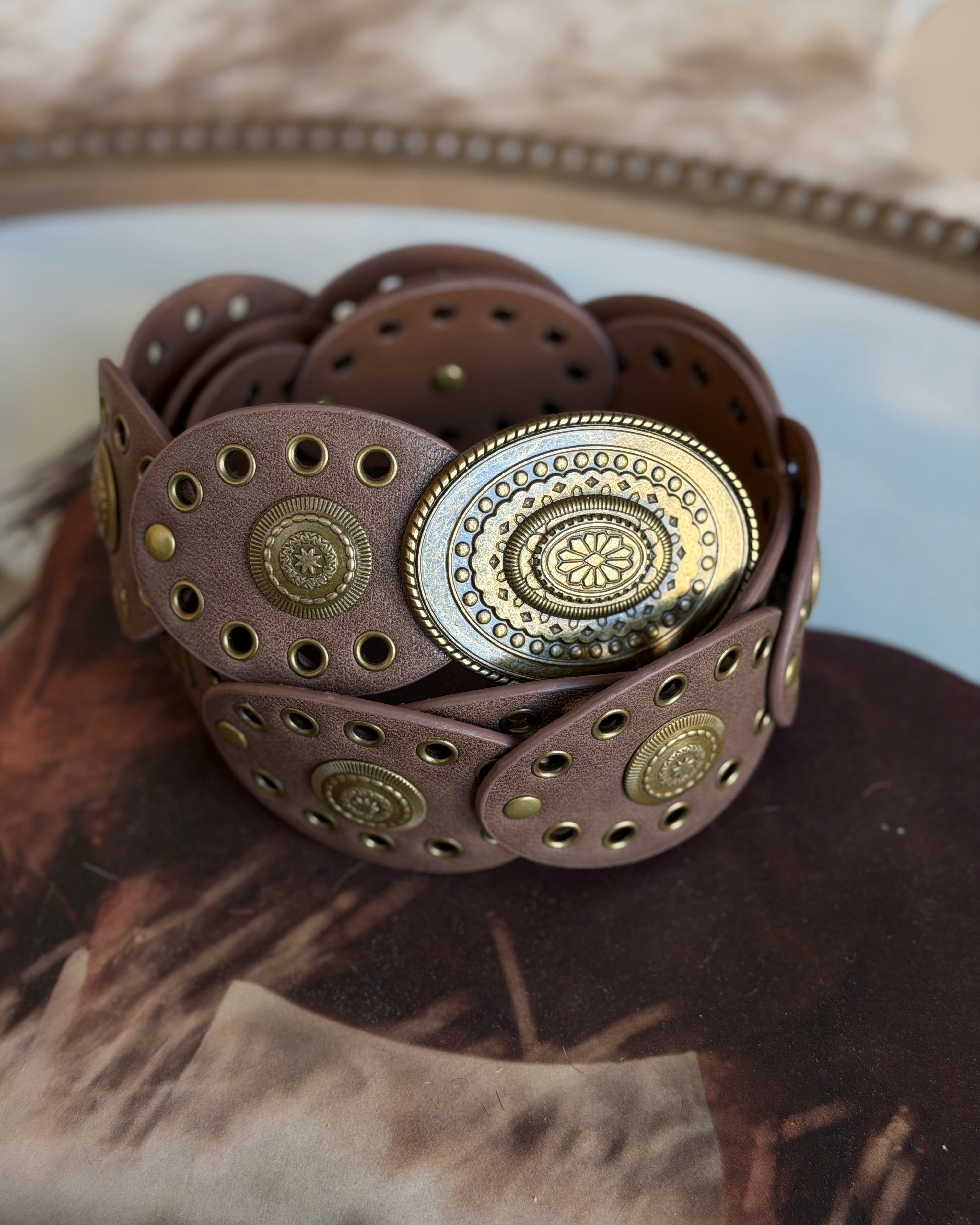 Thunderbird pendant chain necklace displayed on wooden slab with serape fabric underneath - The Wild J