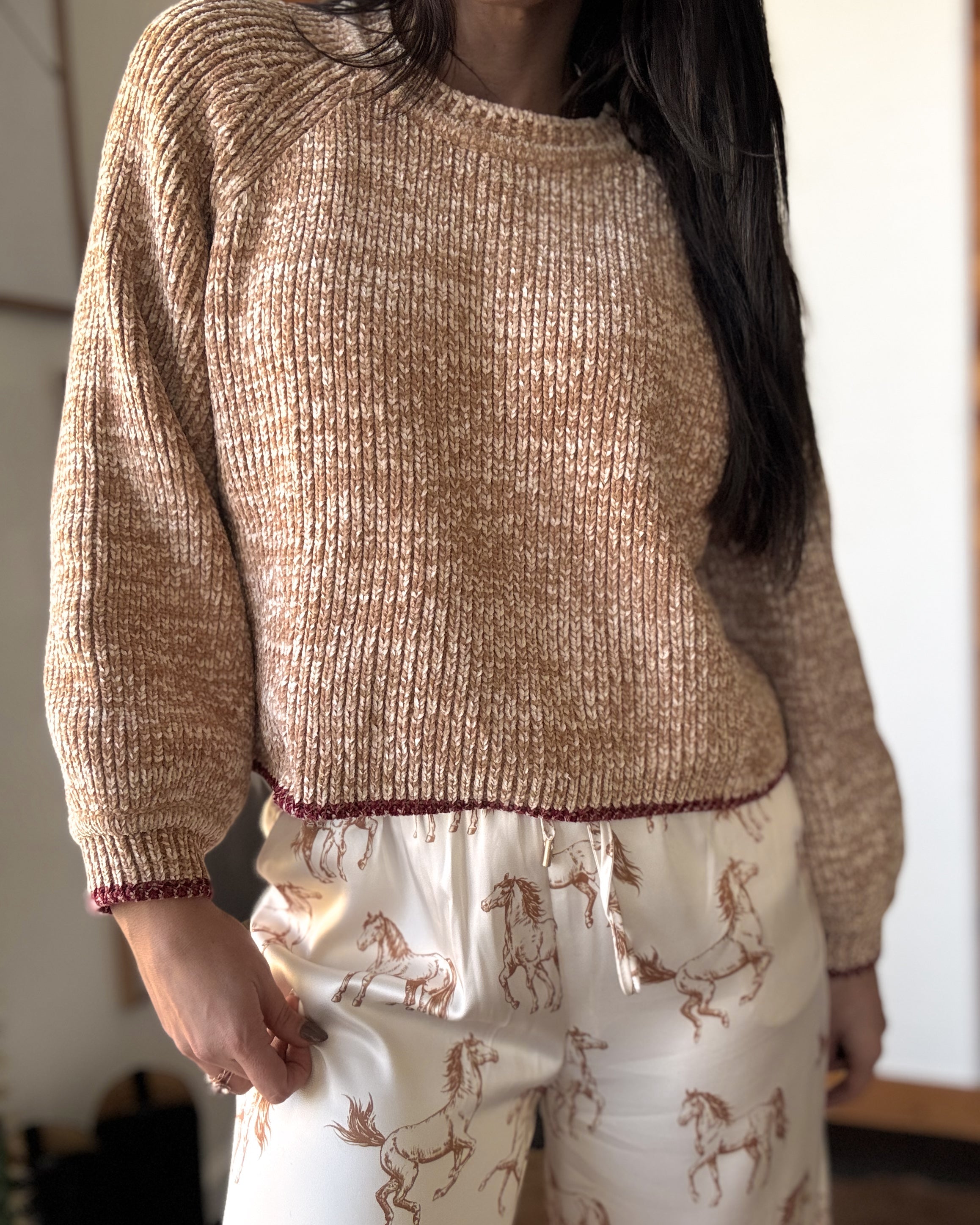 Thunderbird pendant chain necklace displayed on wooden slab with serape fabric underneath - The Wild J