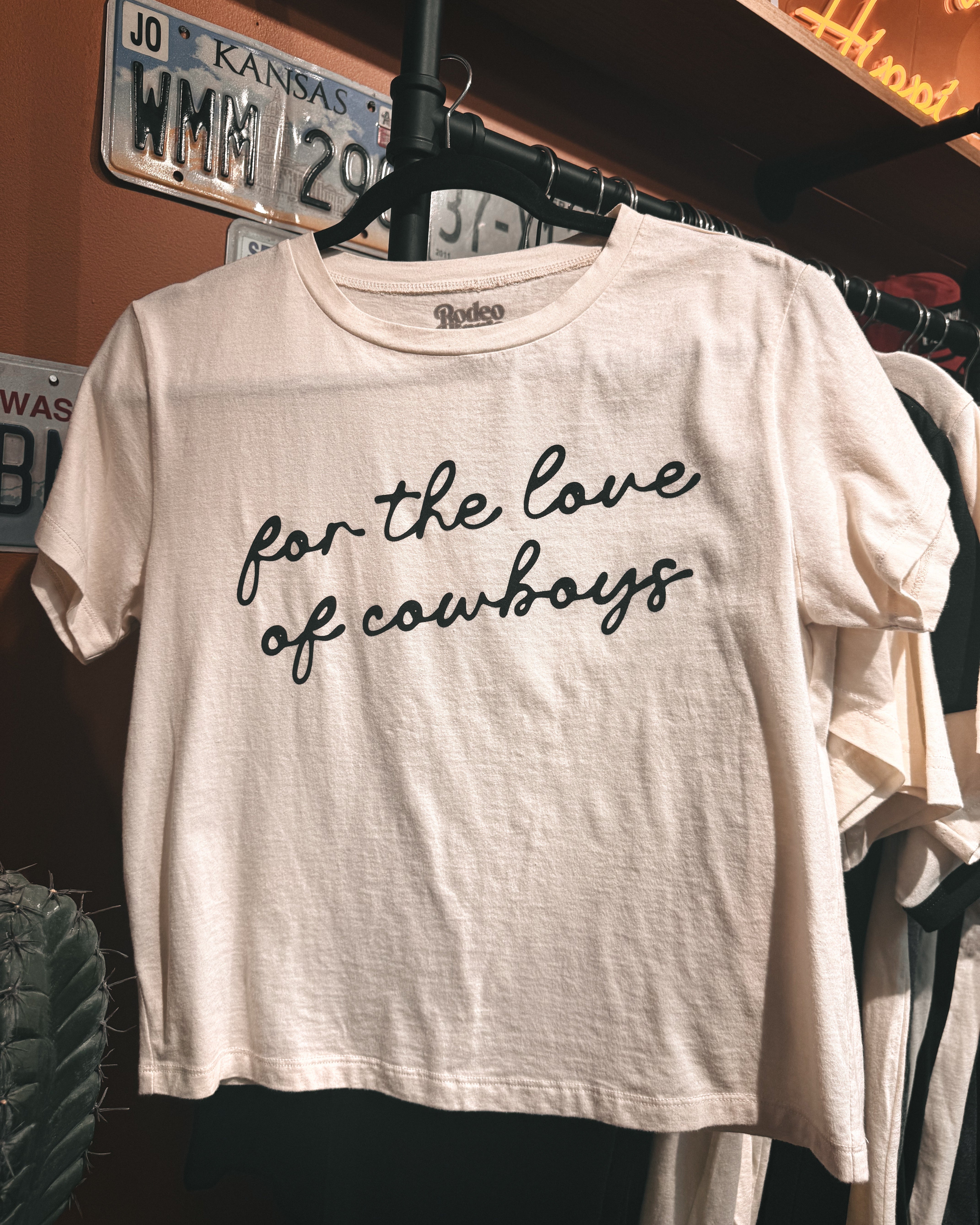 Thunderbird pendant chain necklace displayed on wooden slab with serape fabric underneath - The Wild J