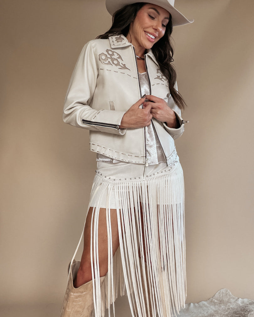 Thunderbird pendant chain necklace displayed on wooden slab with serape fabric underneath - The Wild J