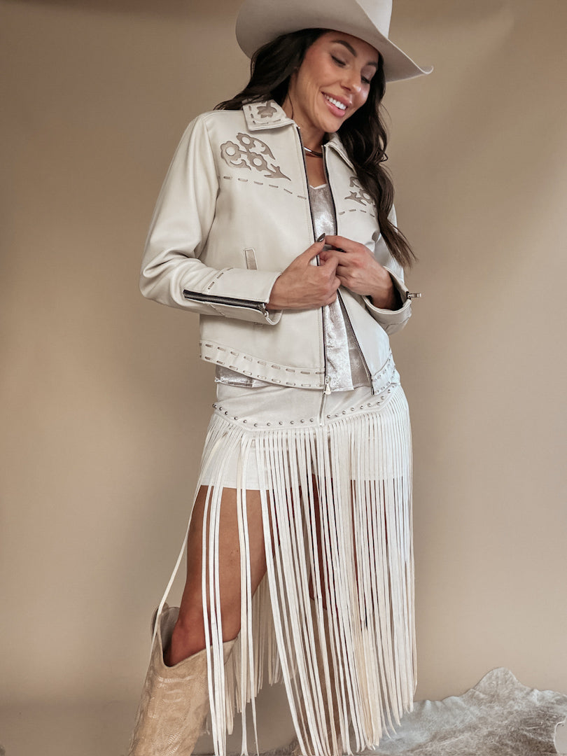 Thunderbird pendant chain necklace displayed on wooden slab with serape fabric underneath - The Wild J