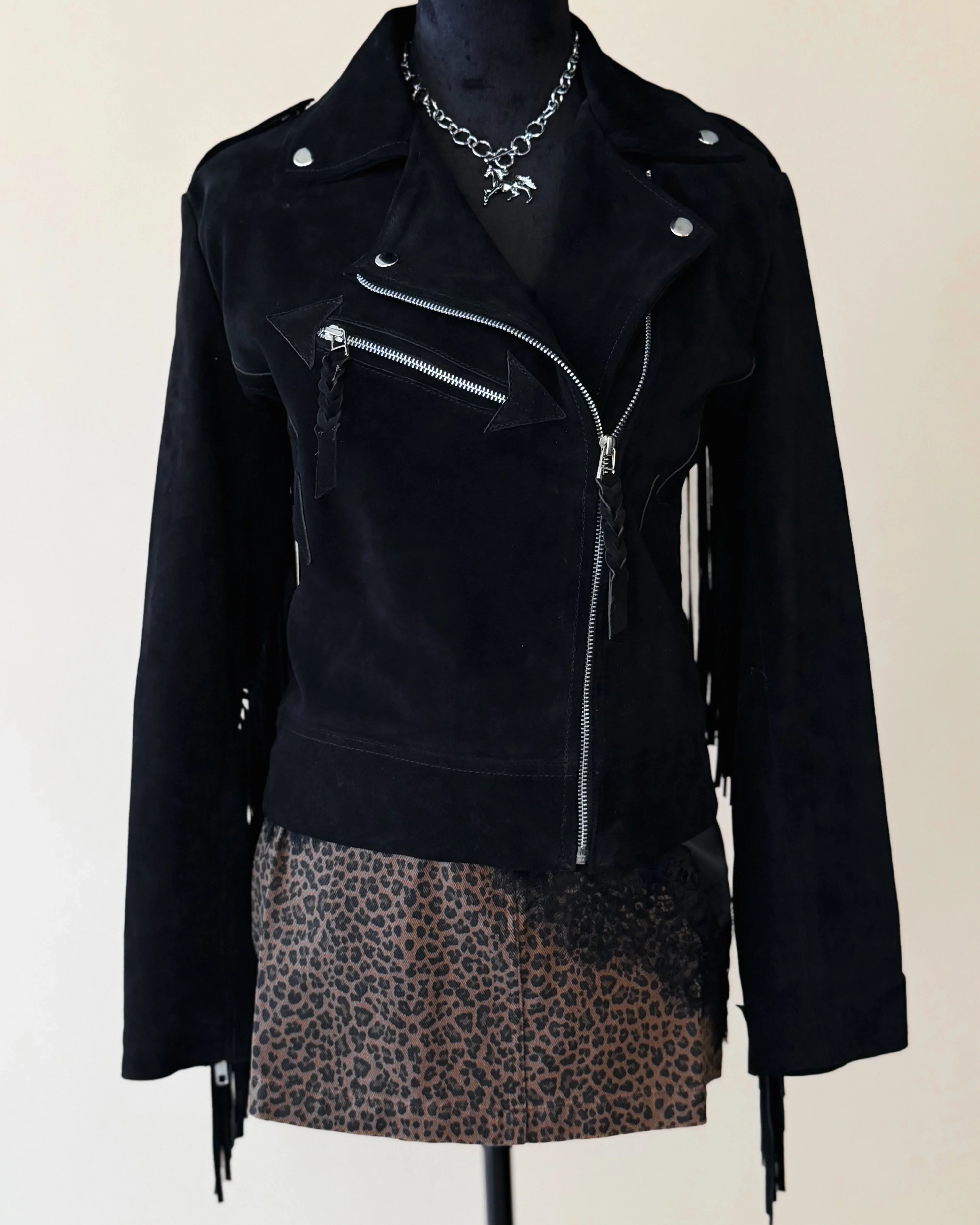 Black suede western fringe jacket with zipper and leopard print skirt, boho cowgirl style