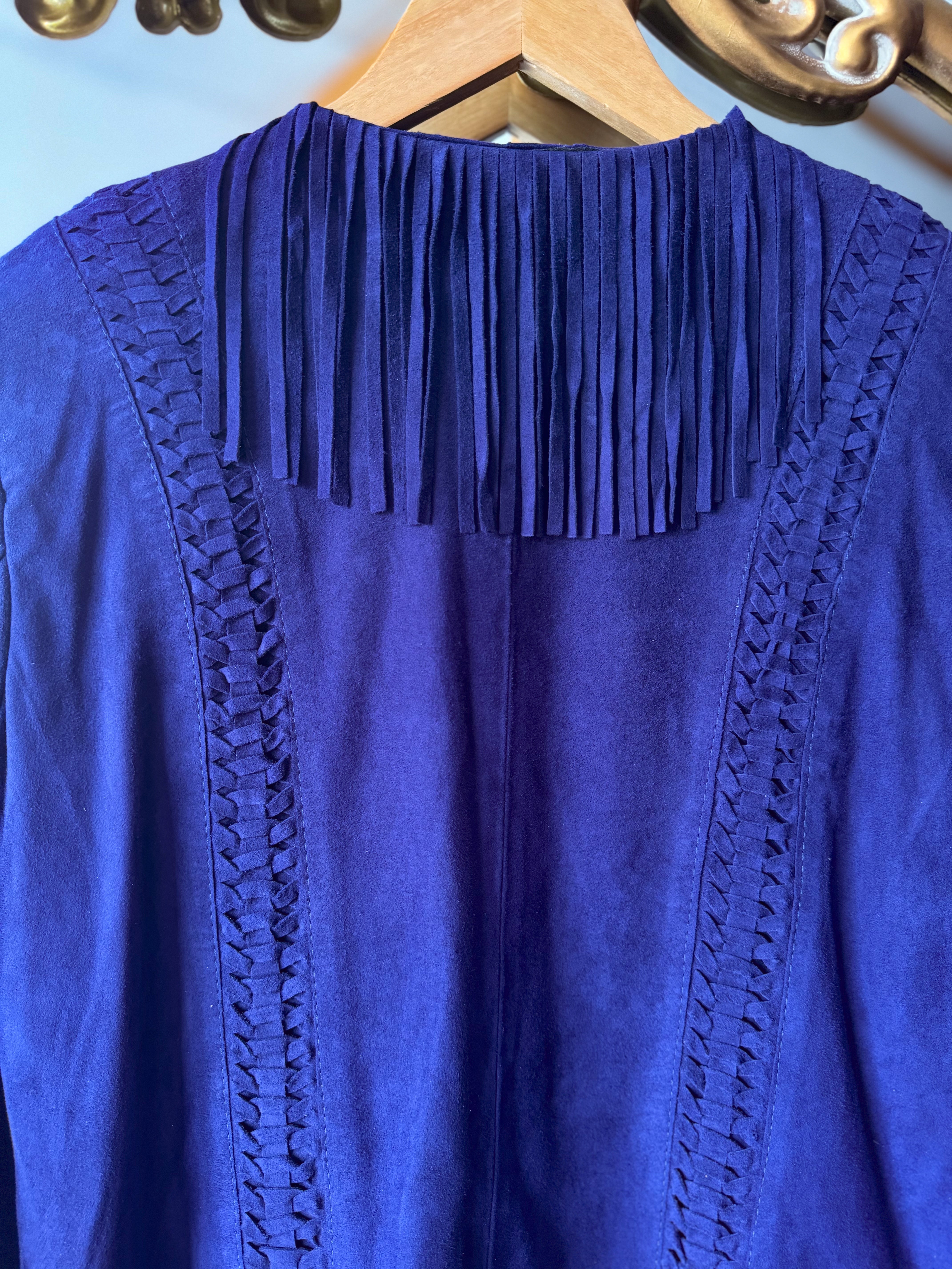 Purple suede western jacket with fringe detail and braided trim on hanger