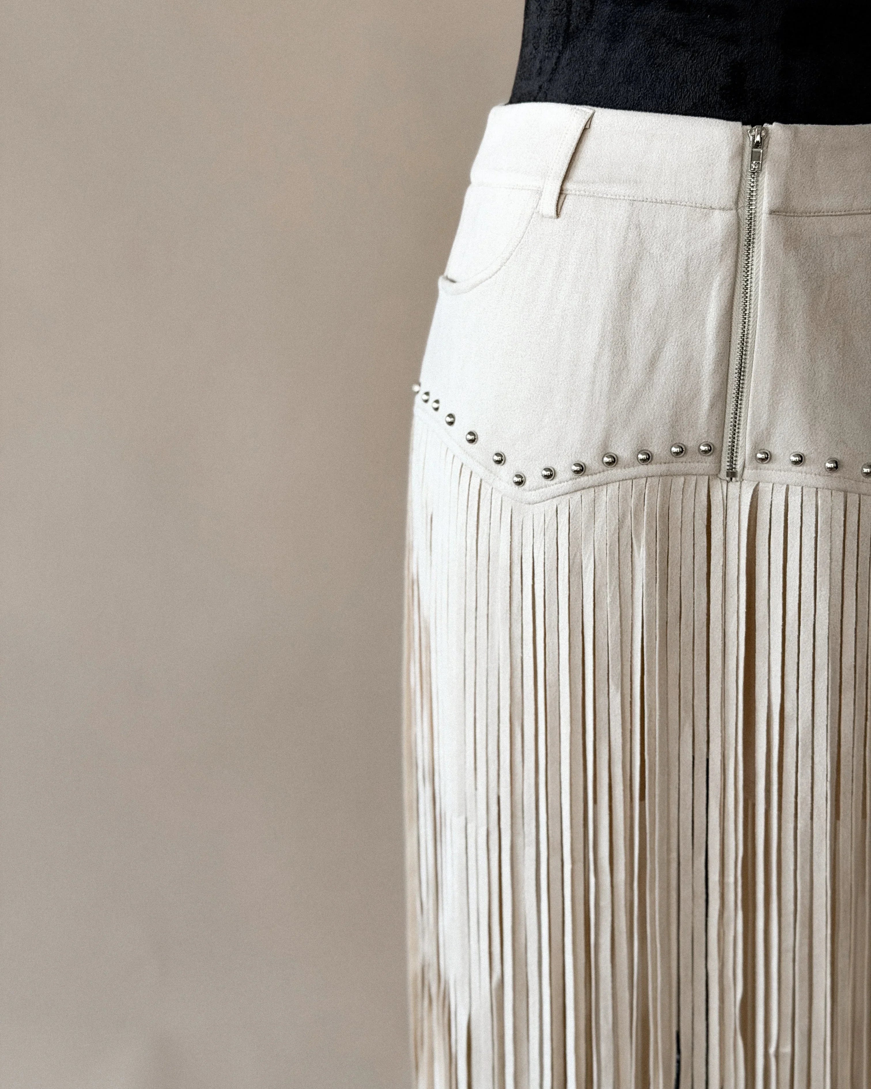 Thunderbird pendant chain necklace displayed on wooden slab with serape fabric underneath - The Wild J