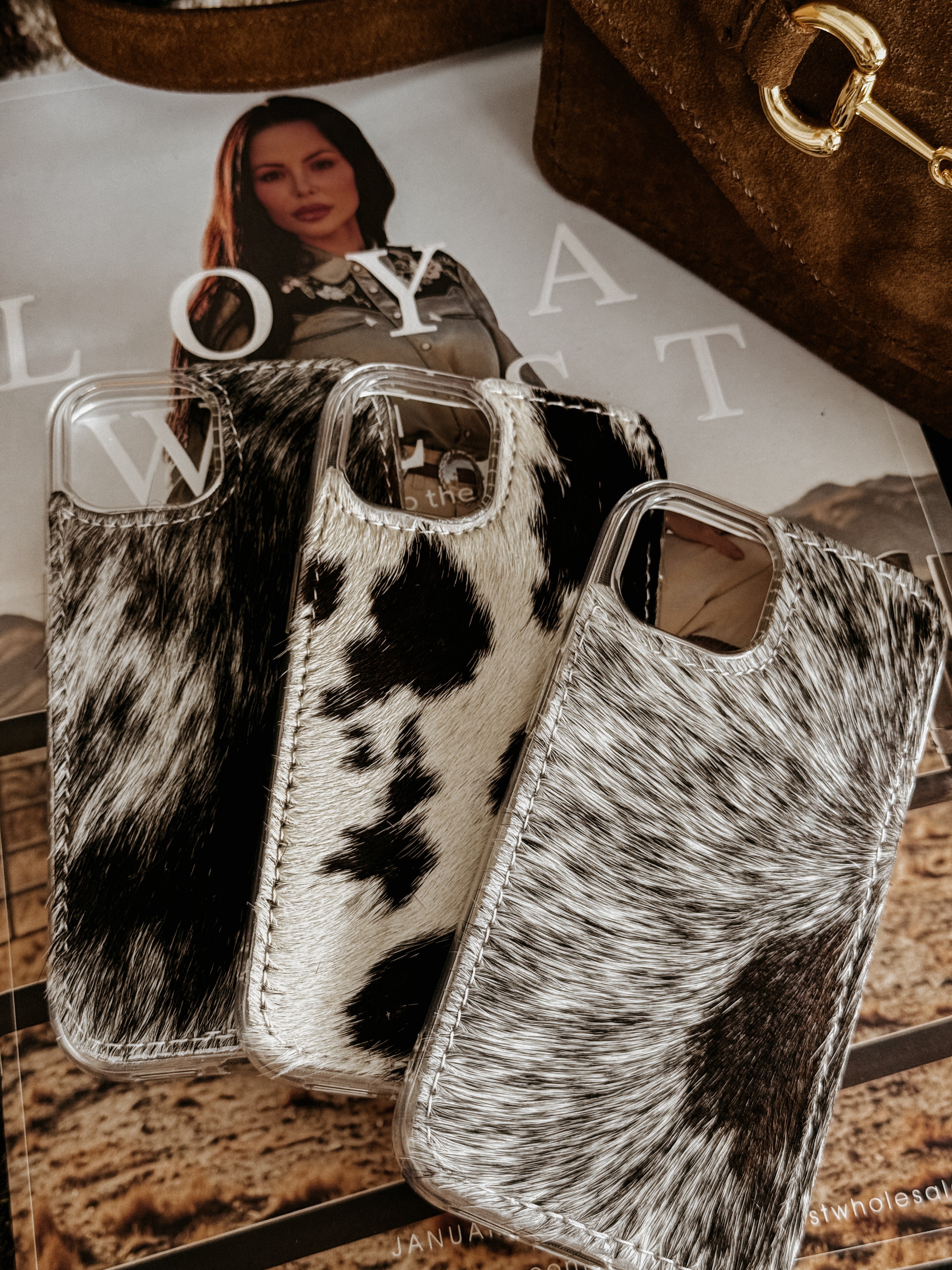 Thunderbird pendant chain necklace displayed on wooden slab with serape fabric underneath - The Wild J