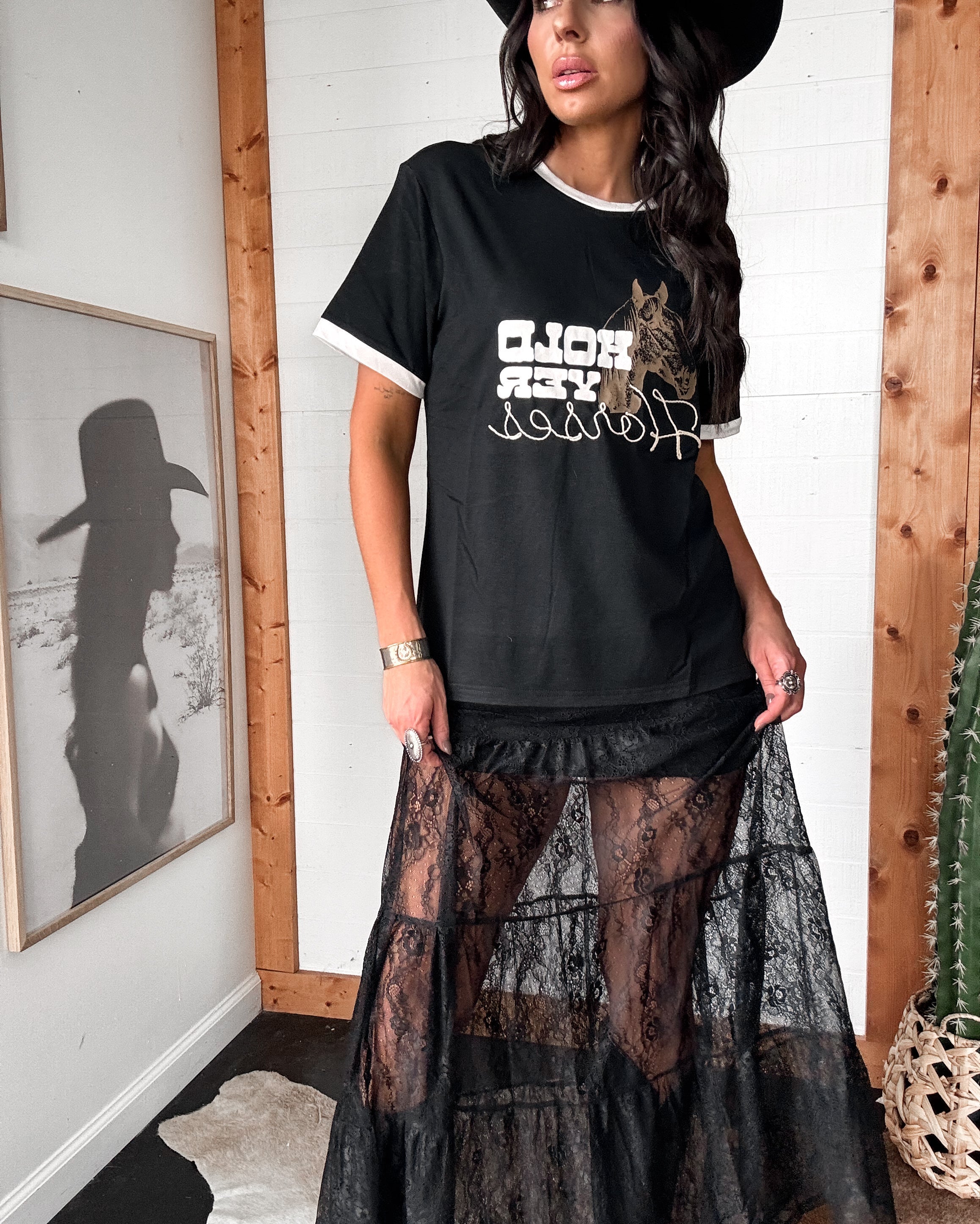 Thunderbird pendant chain necklace displayed on wooden slab with serape fabric underneath - The Wild J