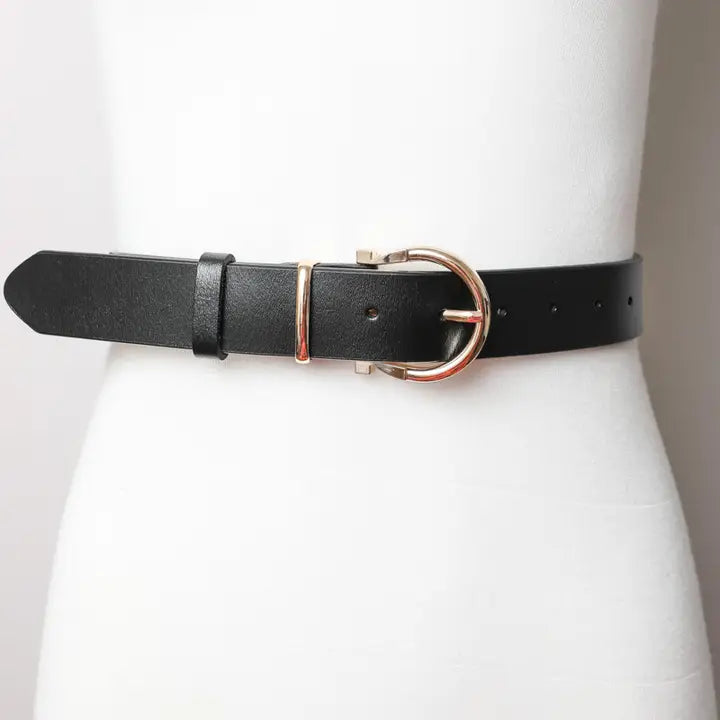 Black western leather belt with gold buckle on mannequin, cowgirl fashion accessory
