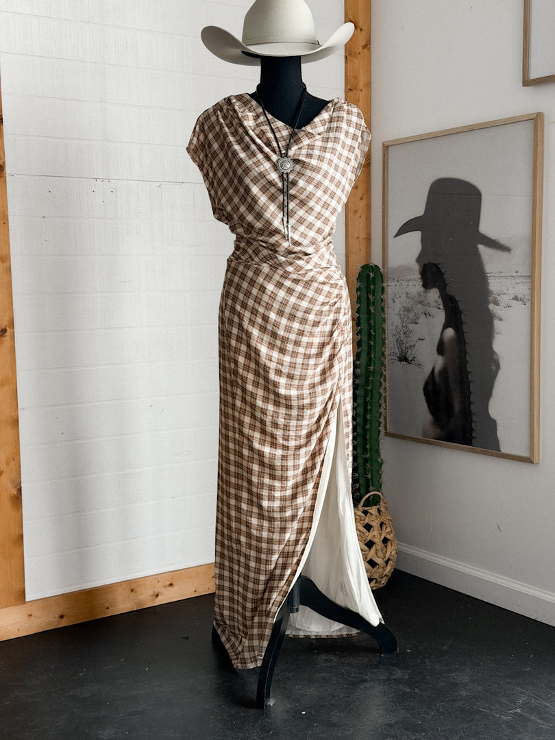 Western boho plaid maxi dress with side slit and concho necklace on mannequin with cowboy hat