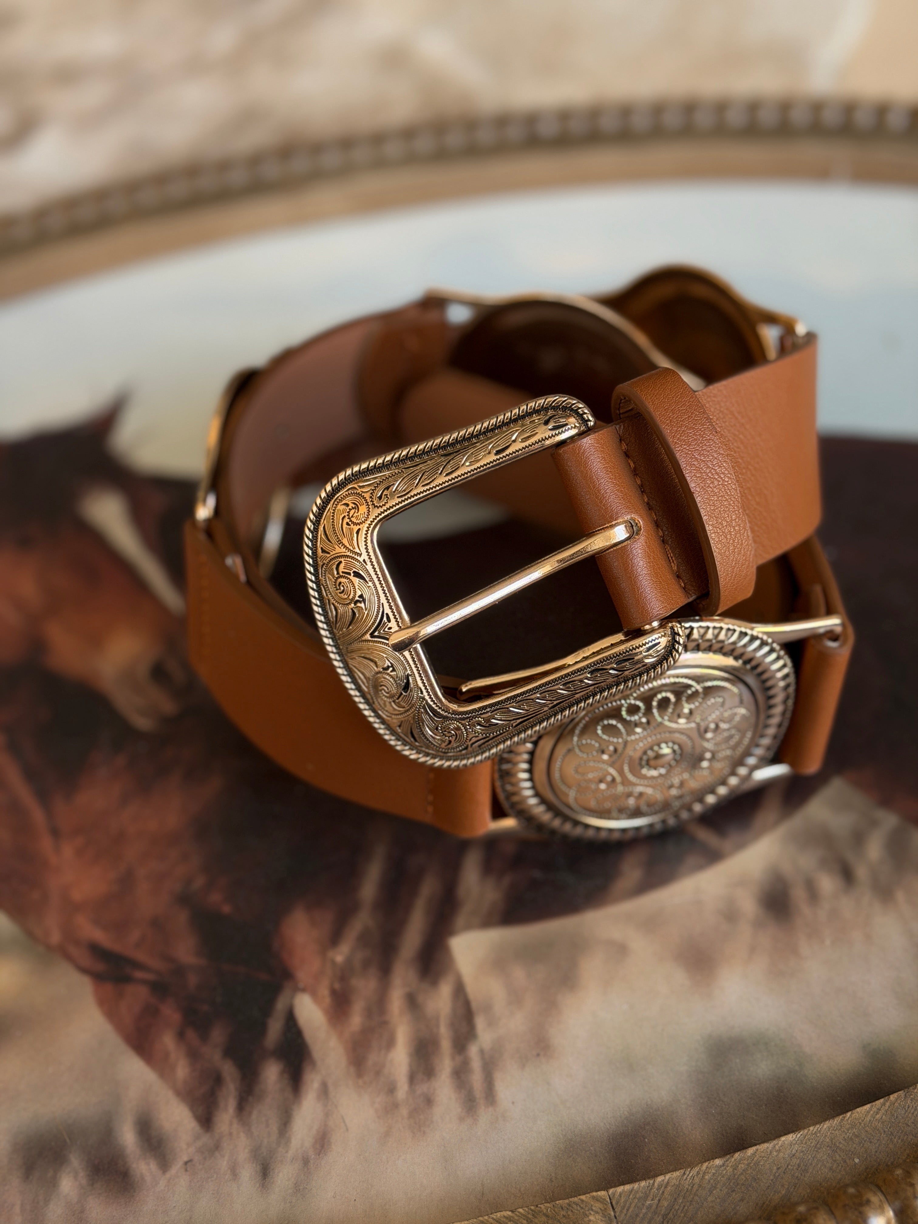 Western boho brown leather belt with ornate silver buckle, cowgirl accessory on horse background
