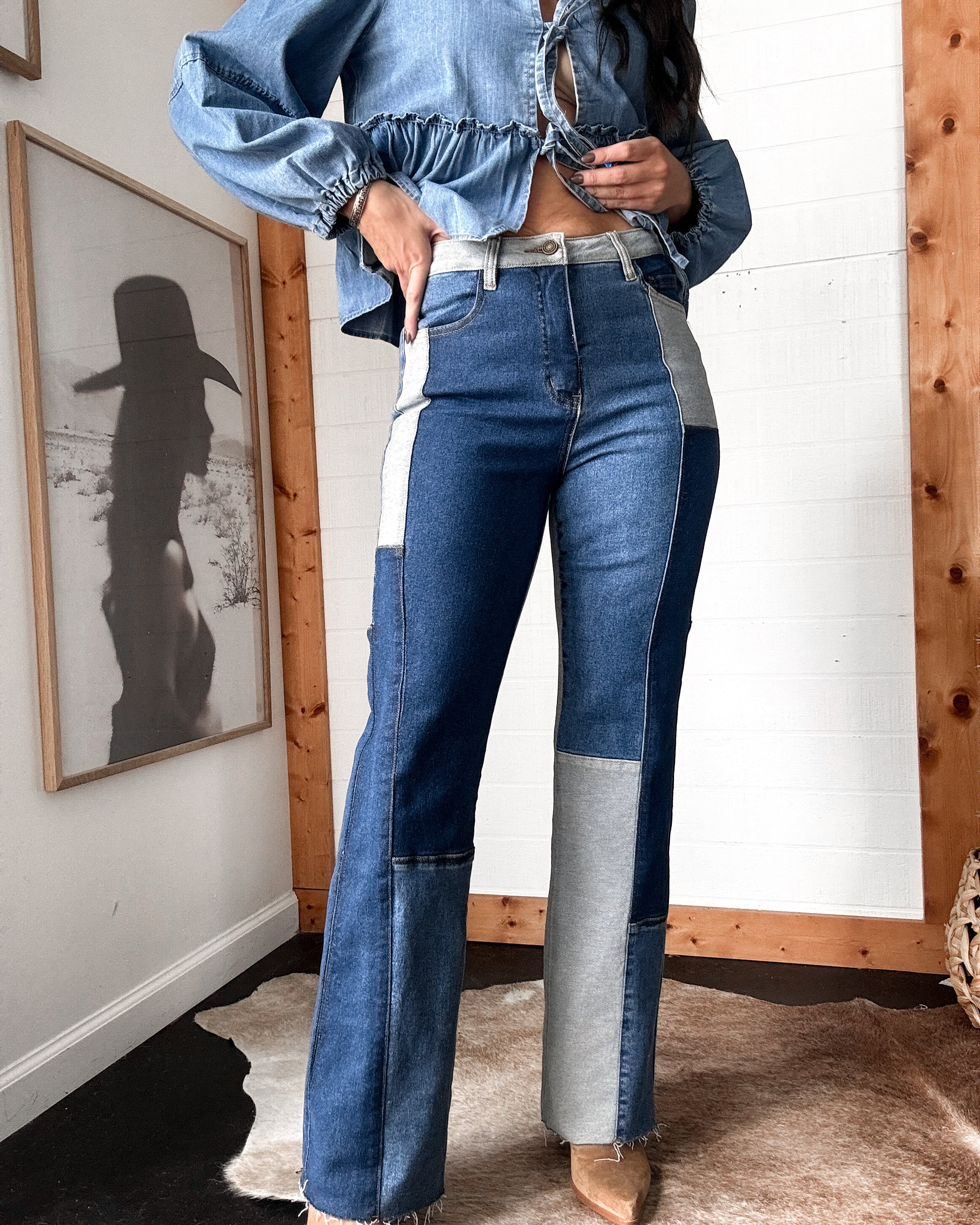 Woman wearing western patchwork denim jeans and a cropped denim top, western boho style