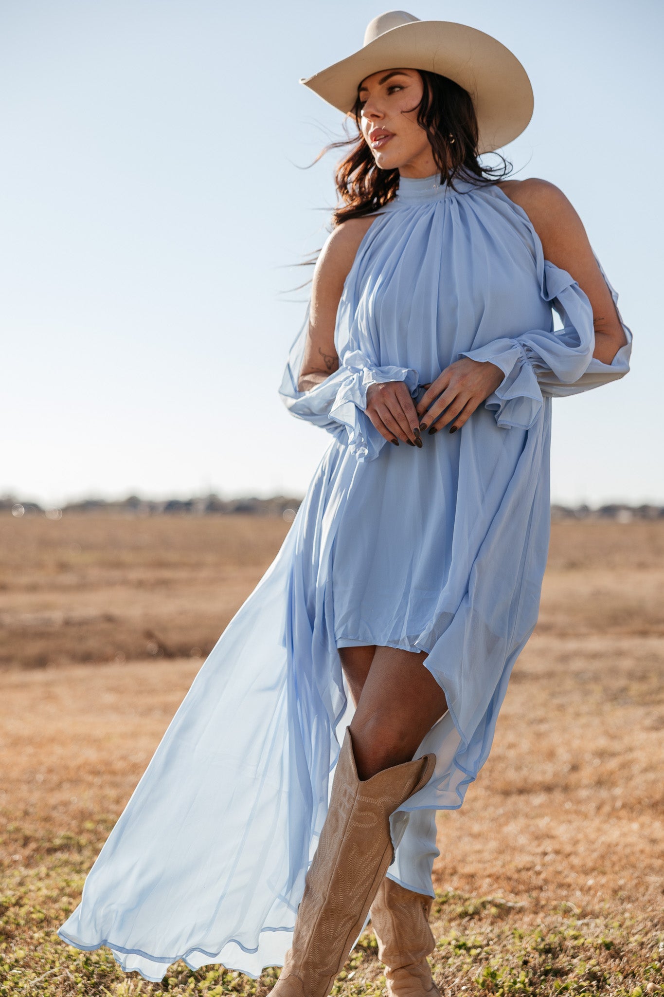 Thunderbird pendant chain necklace displayed on wooden slab with serape fabric underneath - The Wild J