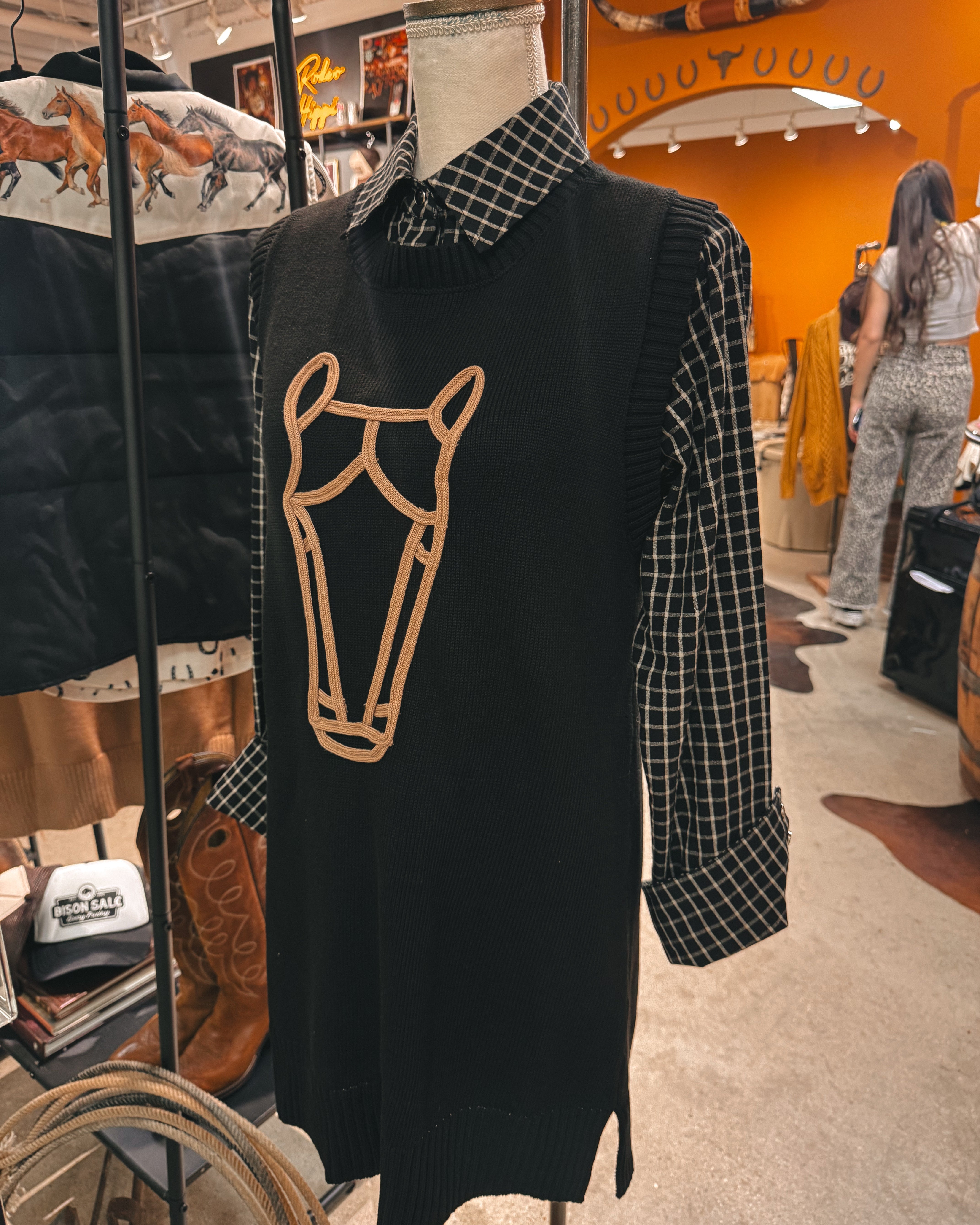 Thunderbird pendant chain necklace displayed on wooden slab with serape fabric underneath - The Wild J