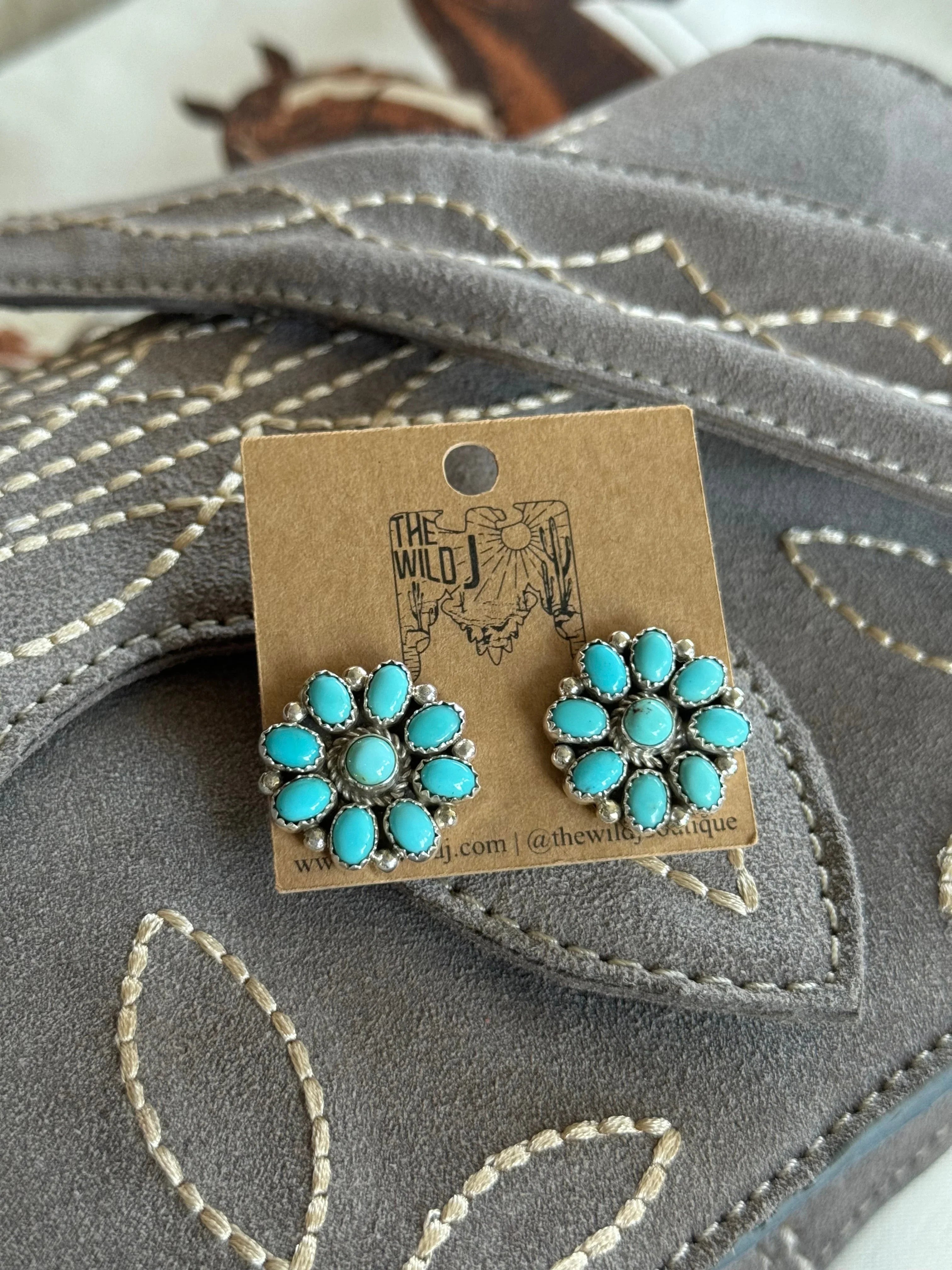 Turquoise concho stud earrings on suede embroidered western purse