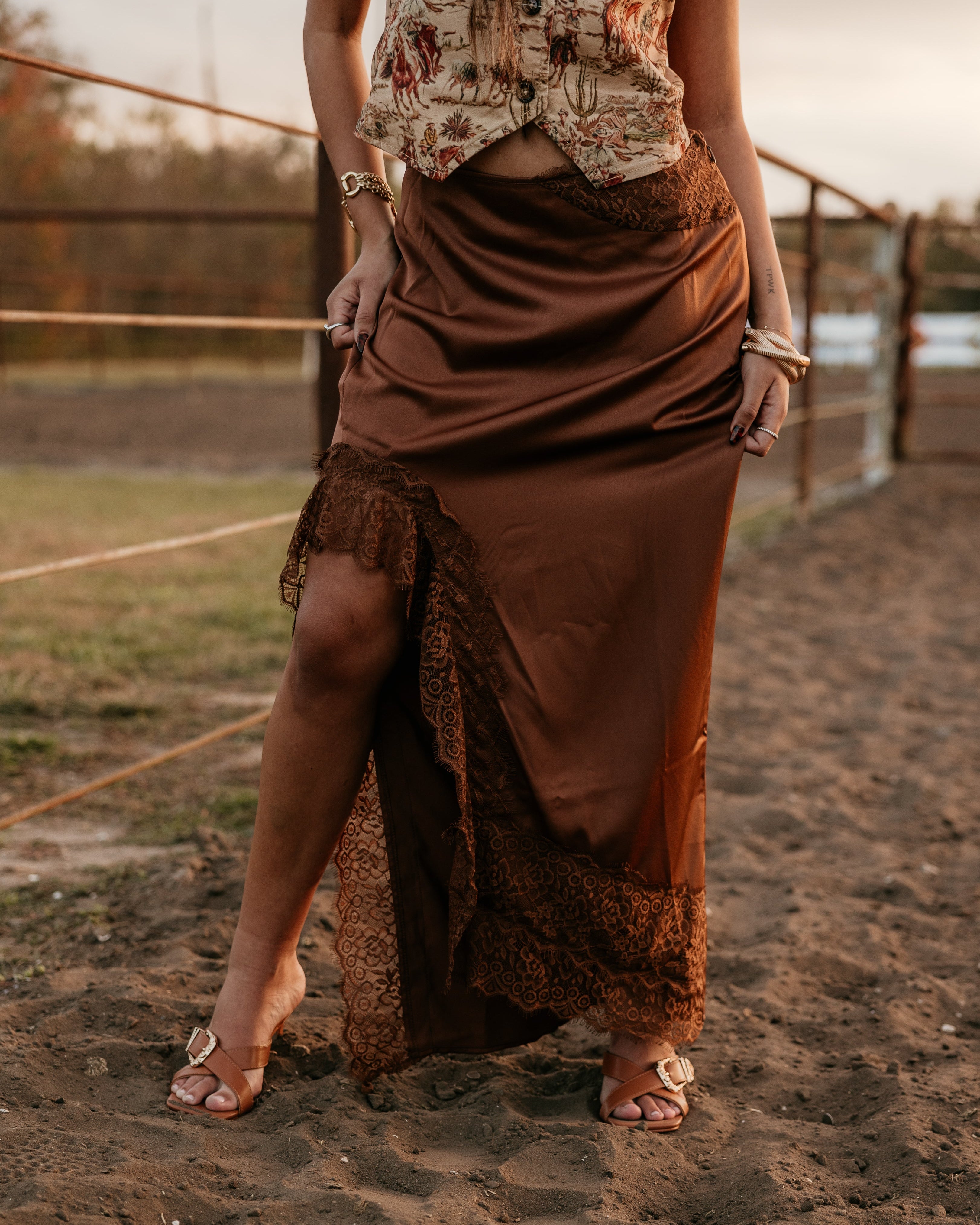 Thunderbird pendant chain necklace displayed on wooden slab with serape fabric underneath - The Wild J