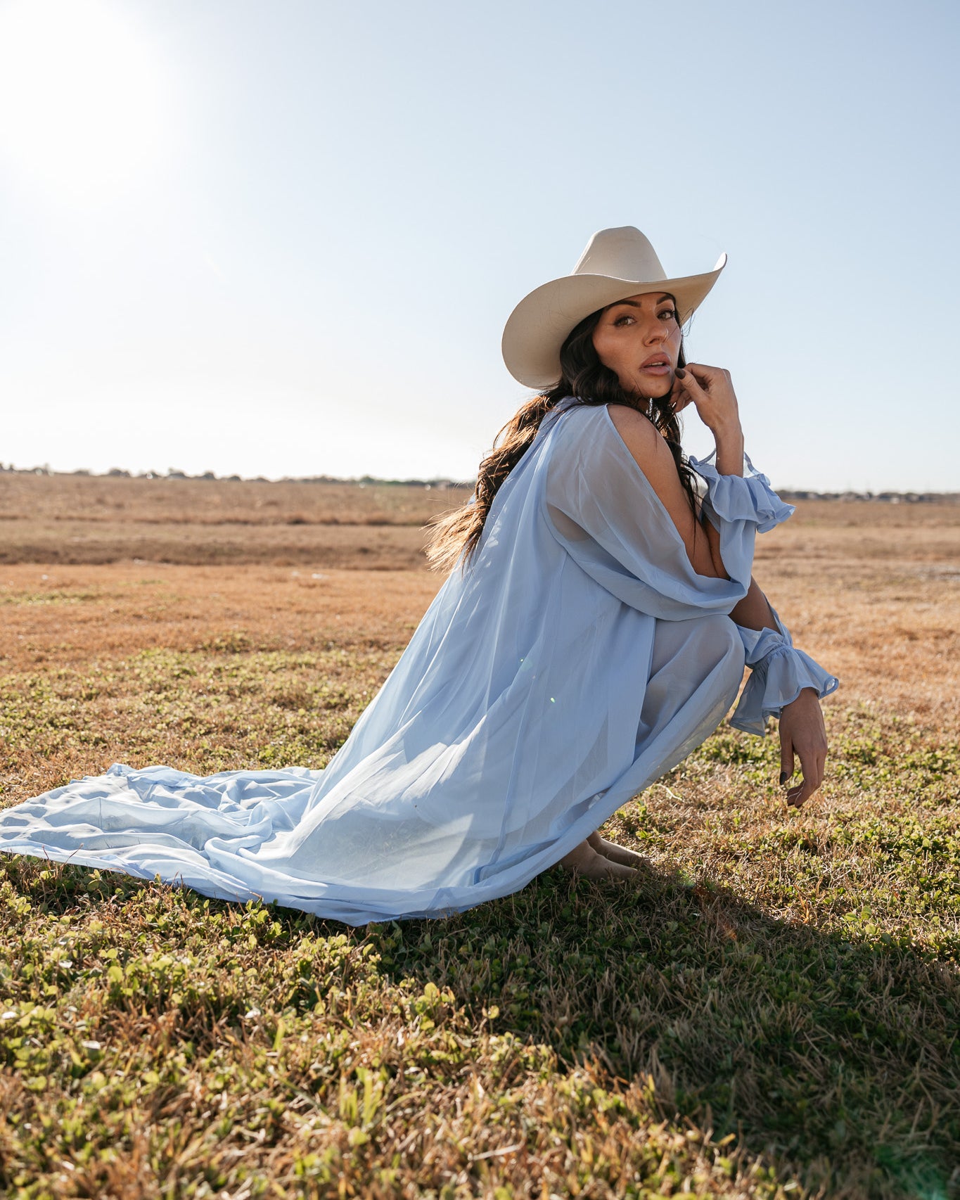 Thunderbird pendant chain necklace displayed on wooden slab with serape fabric underneath - The Wild J