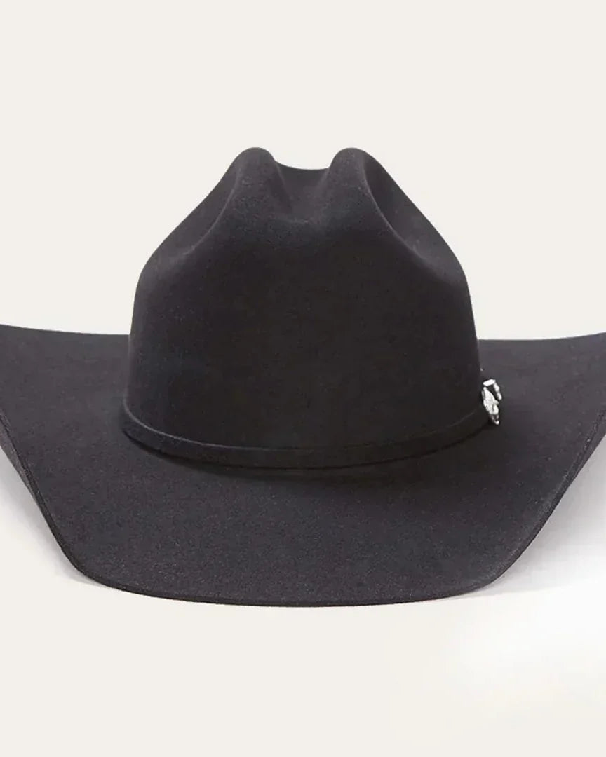 Black cowgirl hat with wide brim and decorative silver accent, classic western style