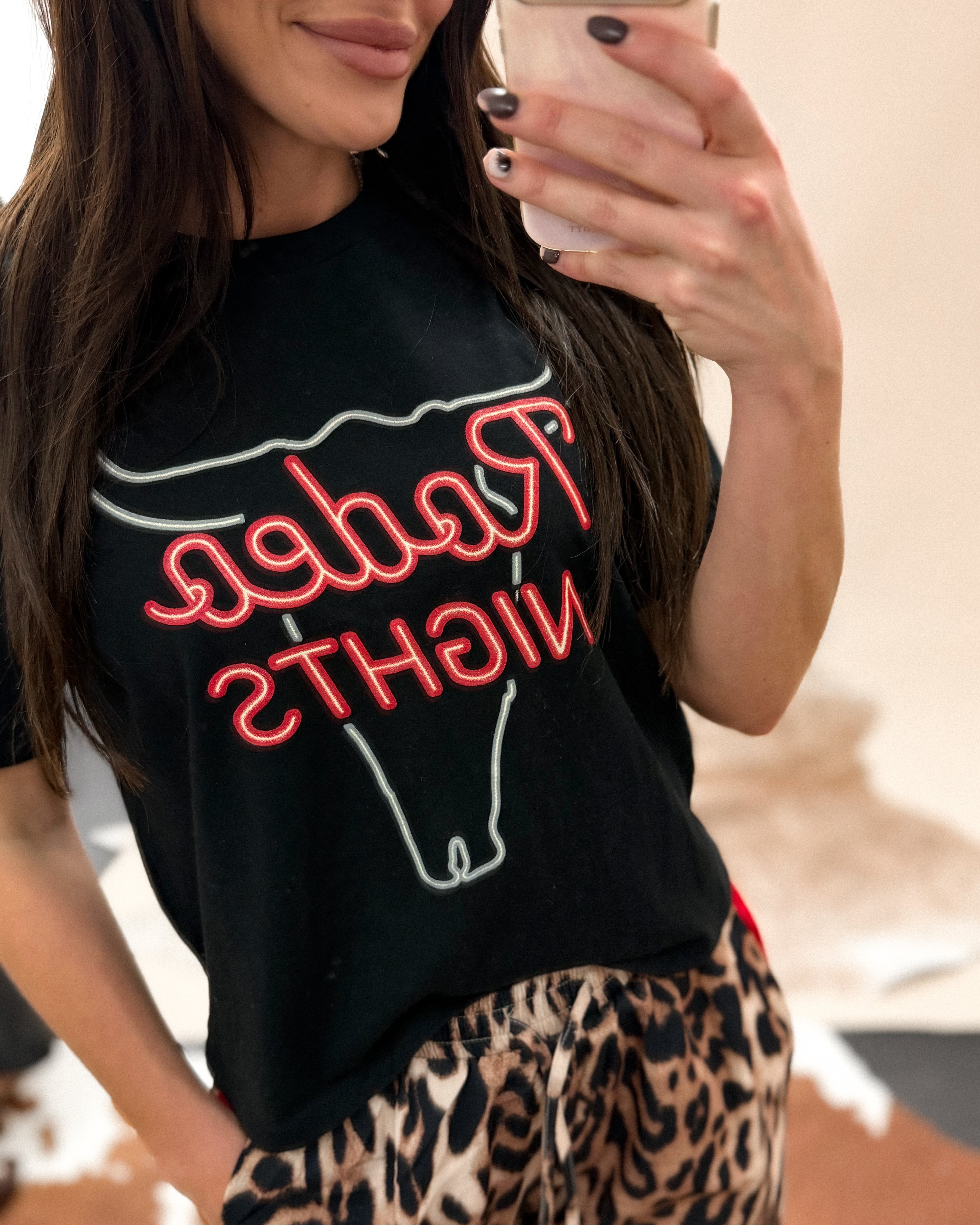 Thunderbird pendant chain necklace displayed on wooden slab with serape fabric underneath - The Wild J