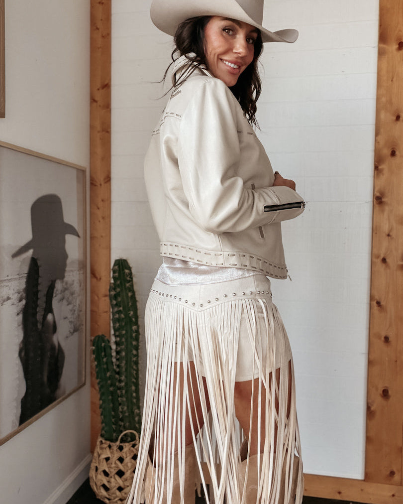 Thunderbird pendant chain necklace displayed on wooden slab with serape fabric underneath - The Wild J