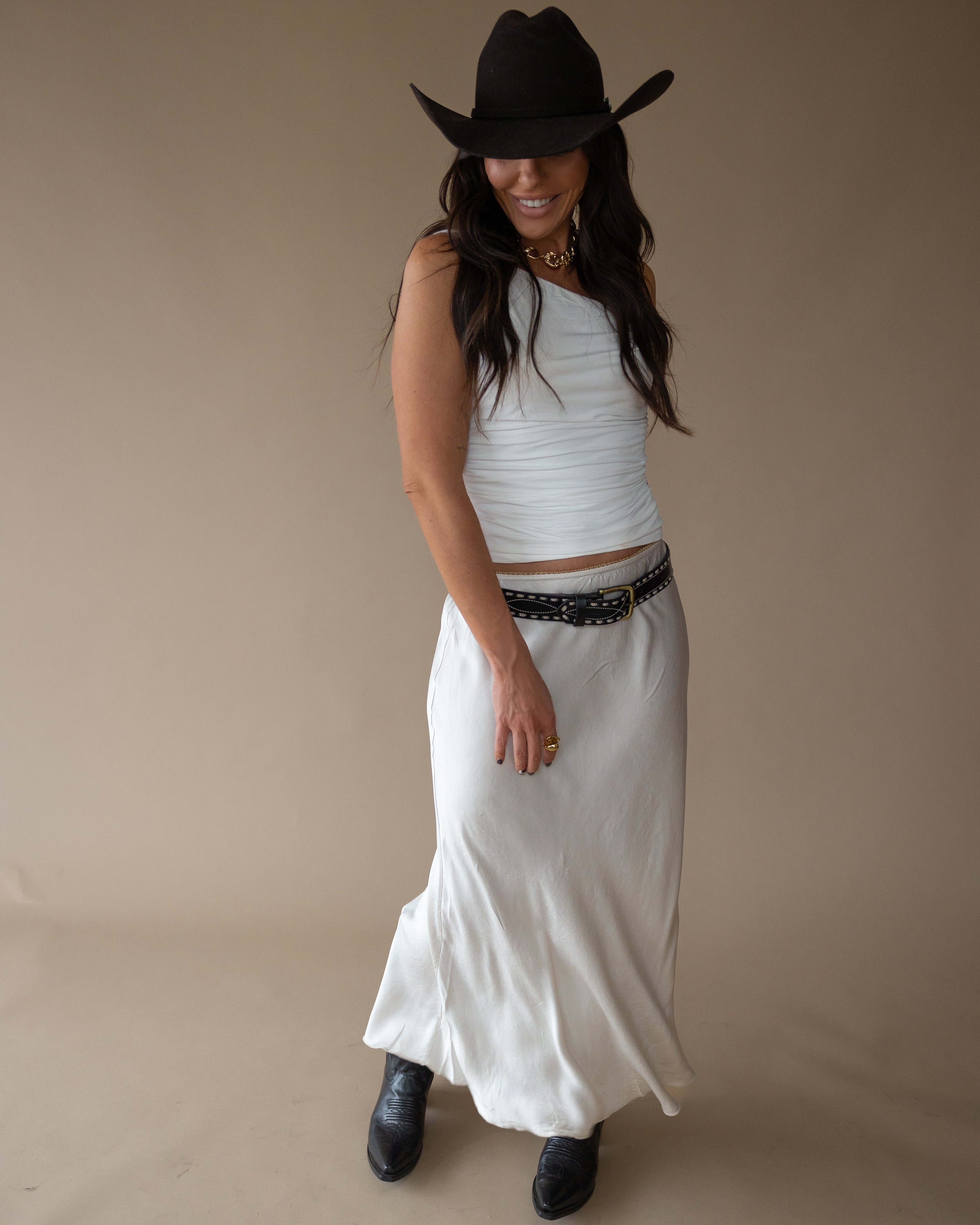 Thunderbird pendant chain necklace displayed on wooden slab with serape fabric underneath - The Wild J