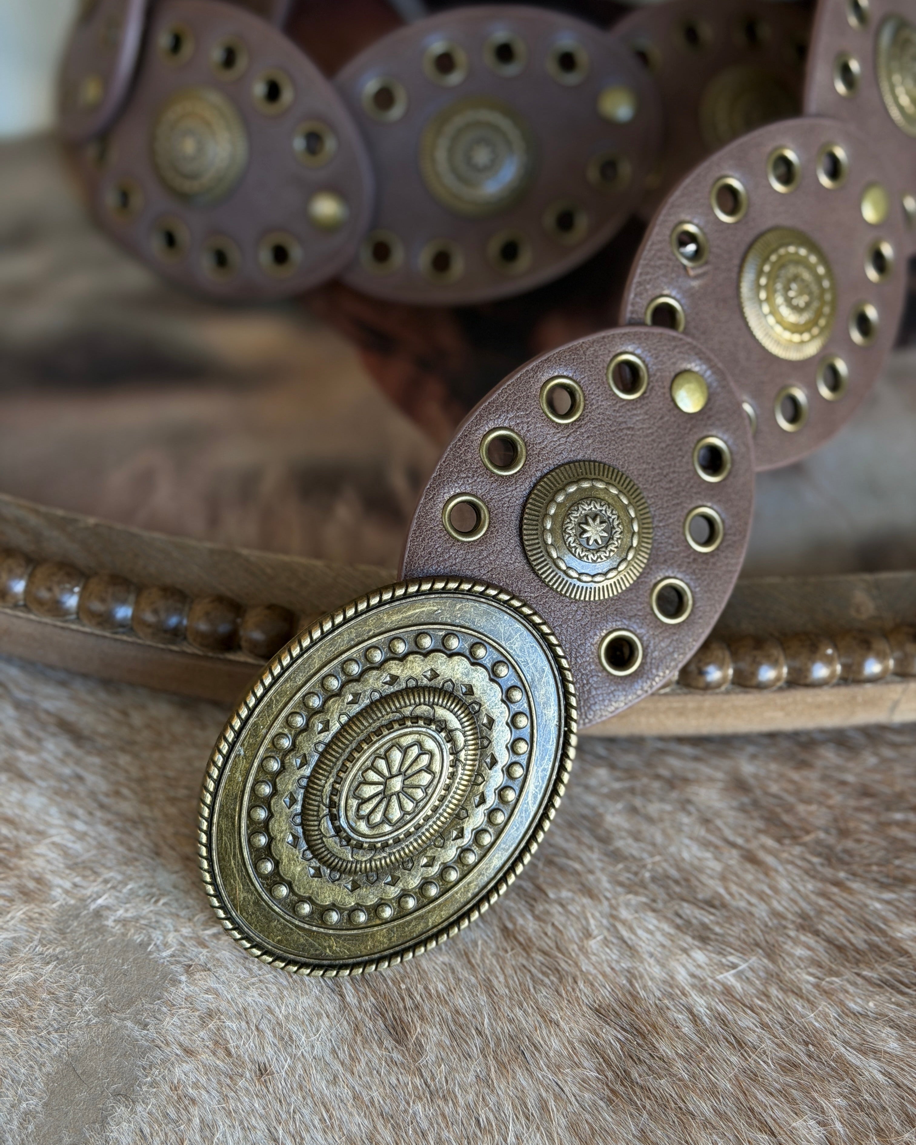 Thunderbird pendant chain necklace displayed on wooden slab with serape fabric underneath - The Wild J