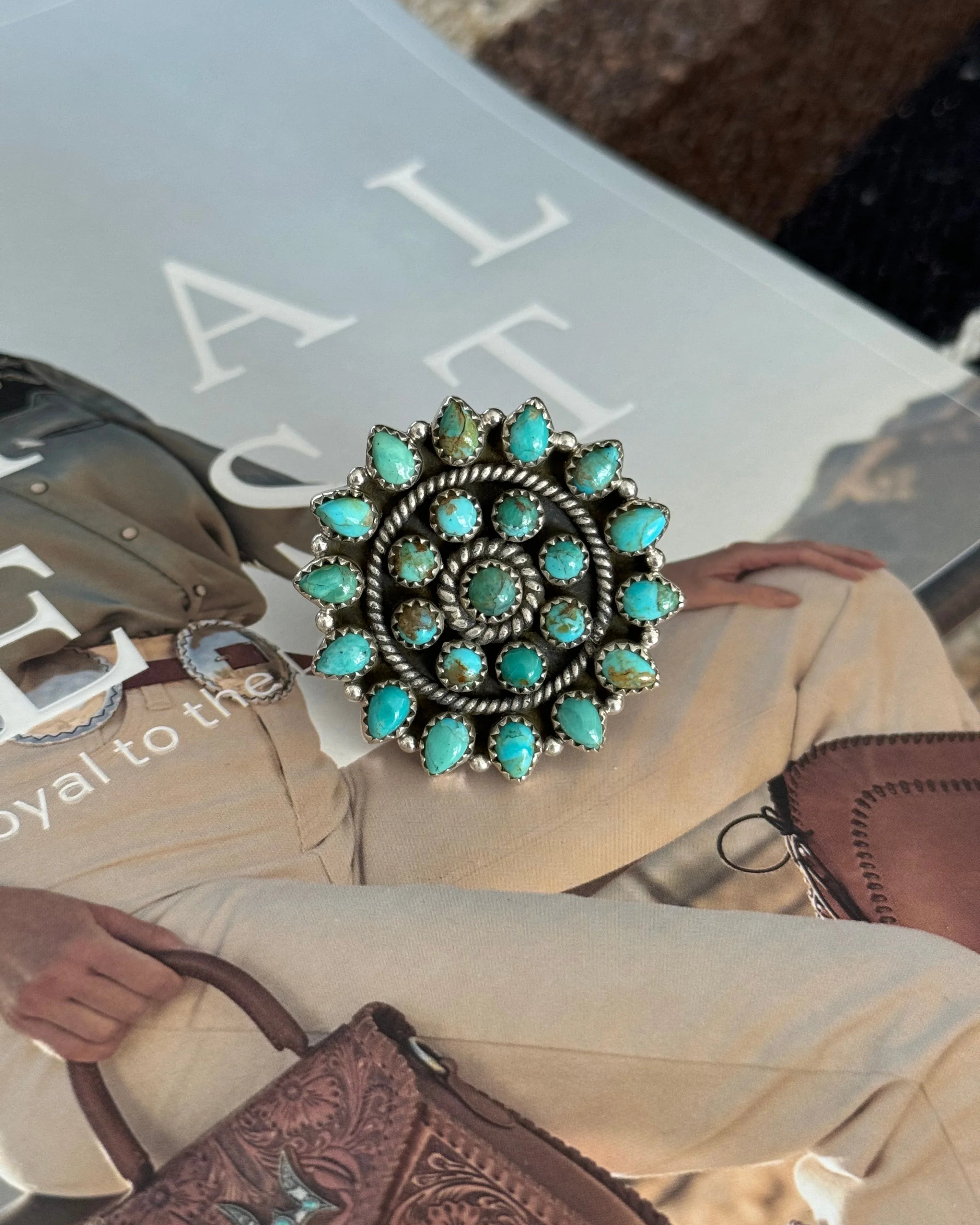 Western turquoise cluster ring with silver detailing in boho cowgirl jewelry style