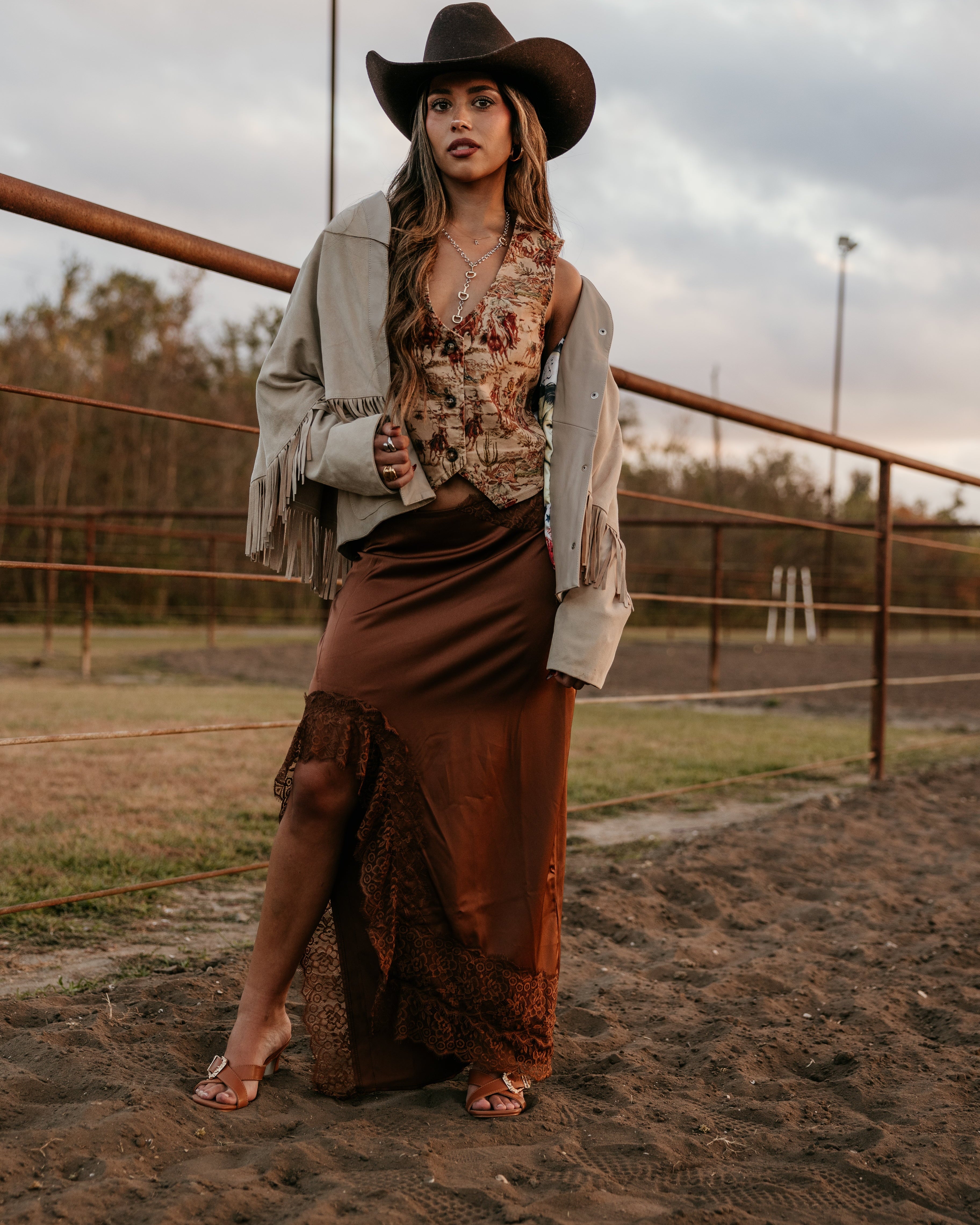 Thunderbird pendant chain necklace displayed on wooden slab with serape fabric underneath - The Wild J