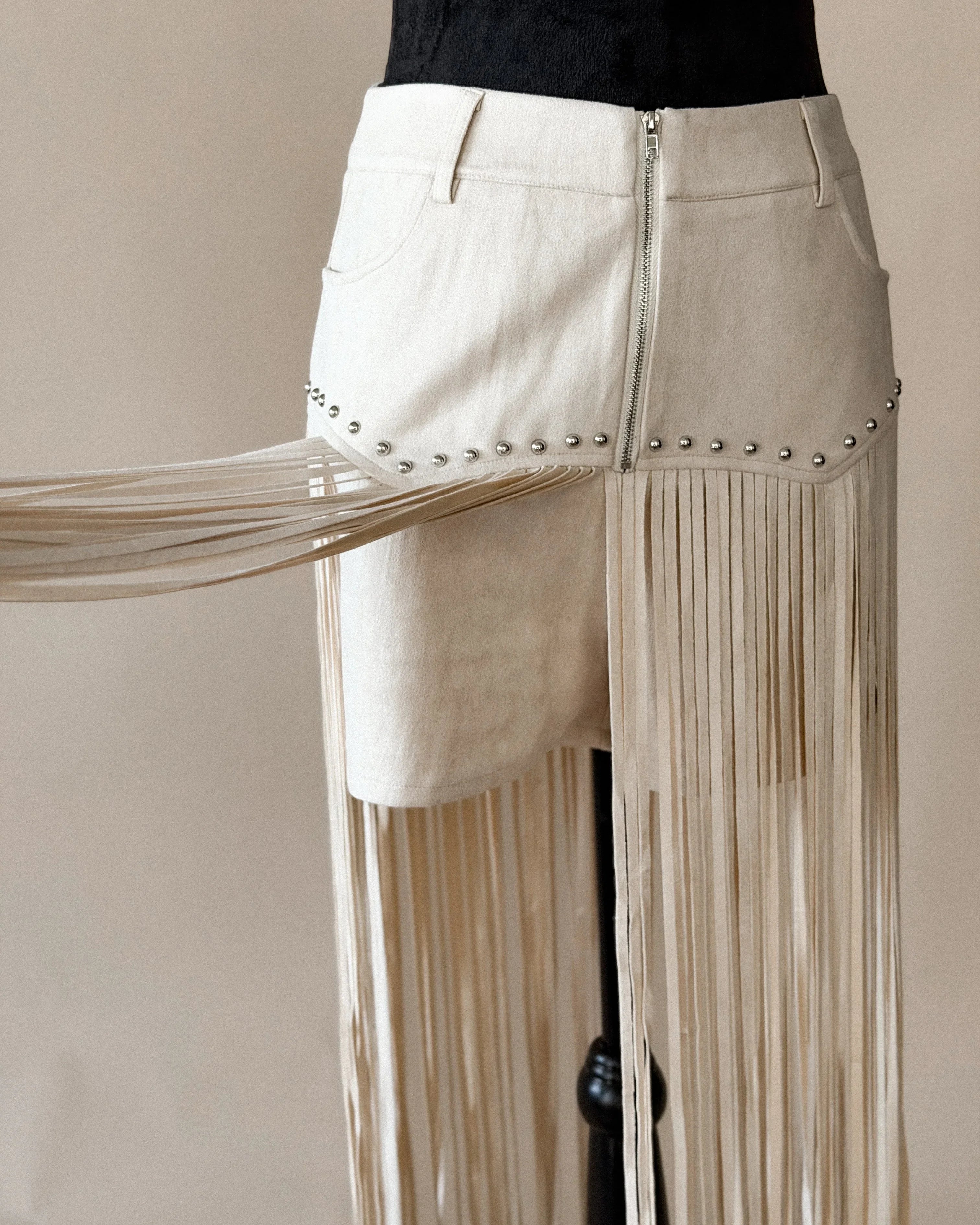 Thunderbird pendant chain necklace displayed on wooden slab with serape fabric underneath - The Wild J