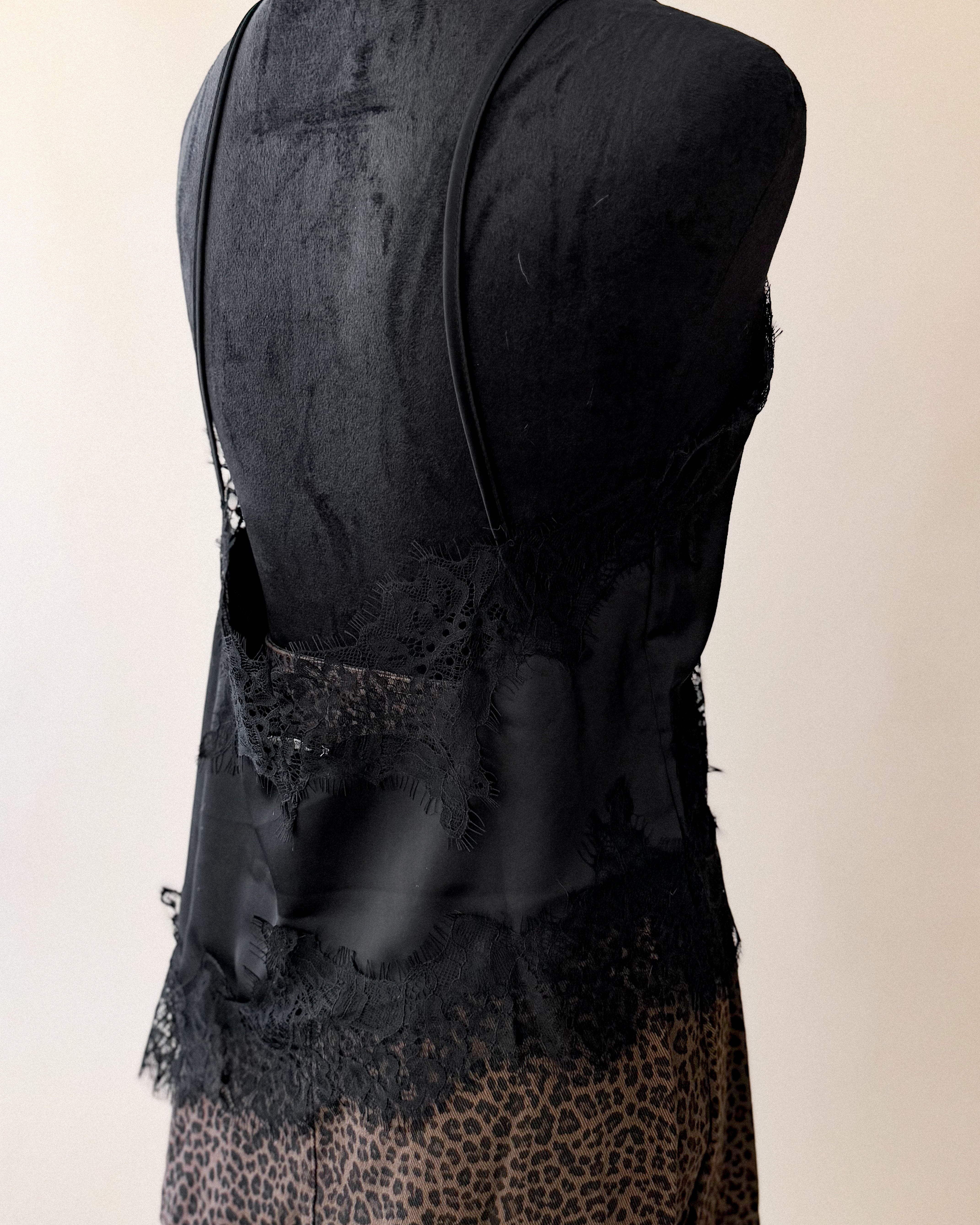 Black lace trim camisole top with spaghetti straps and leopard print skirt on mannequin