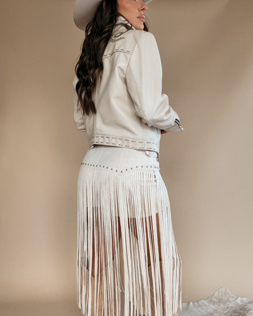 Thunderbird pendant chain necklace displayed on wooden slab with serape fabric underneath - The Wild J