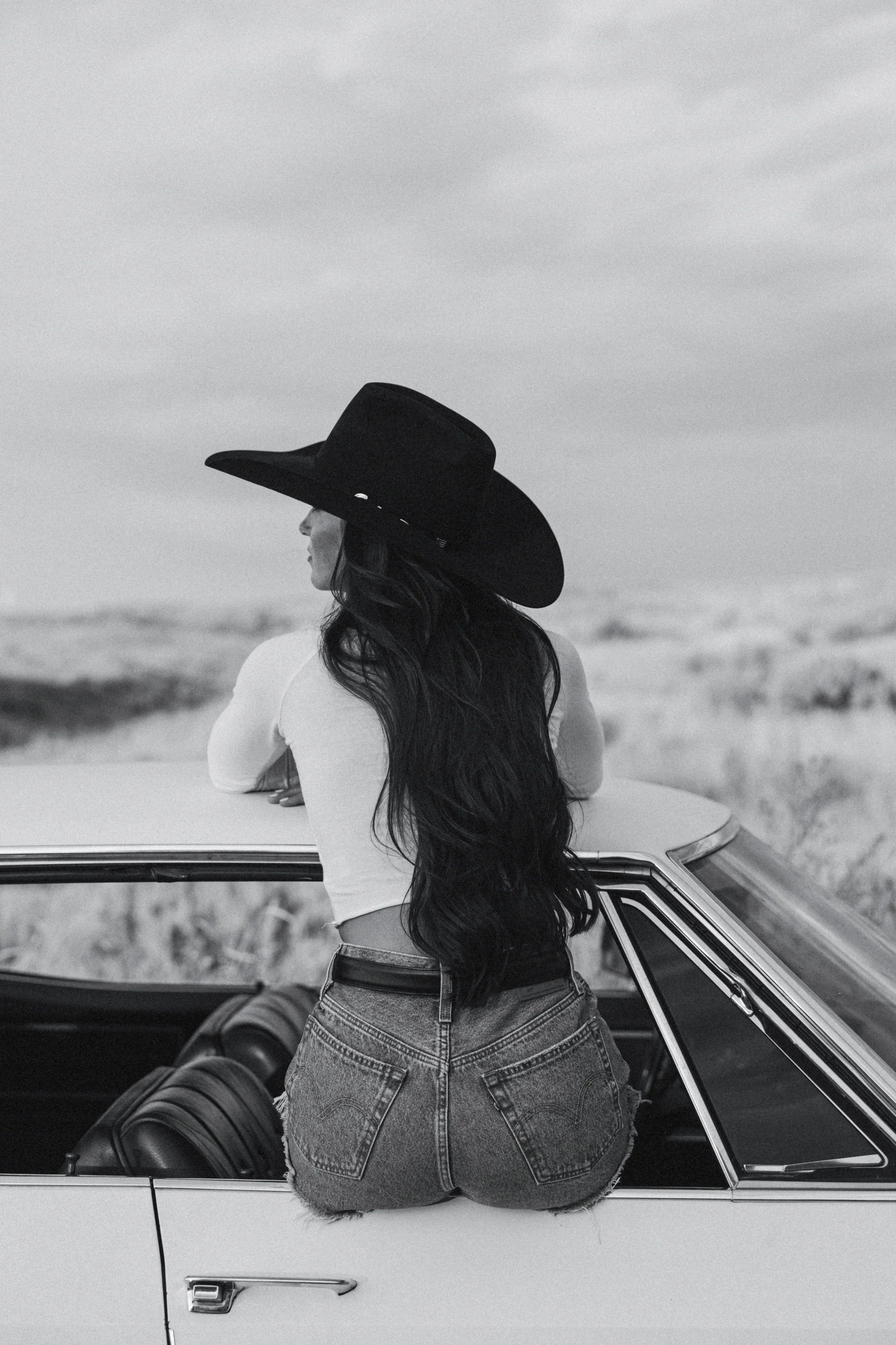 Thunderbird pendant chain necklace displayed on wooden slab with serape fabric underneath - The Wild J