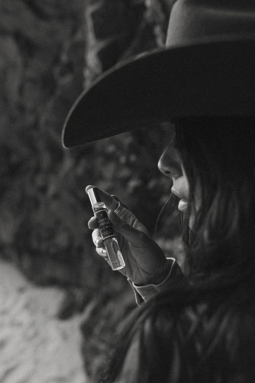 Thunderbird pendant chain necklace displayed on wooden slab with serape fabric underneath - The Wild J