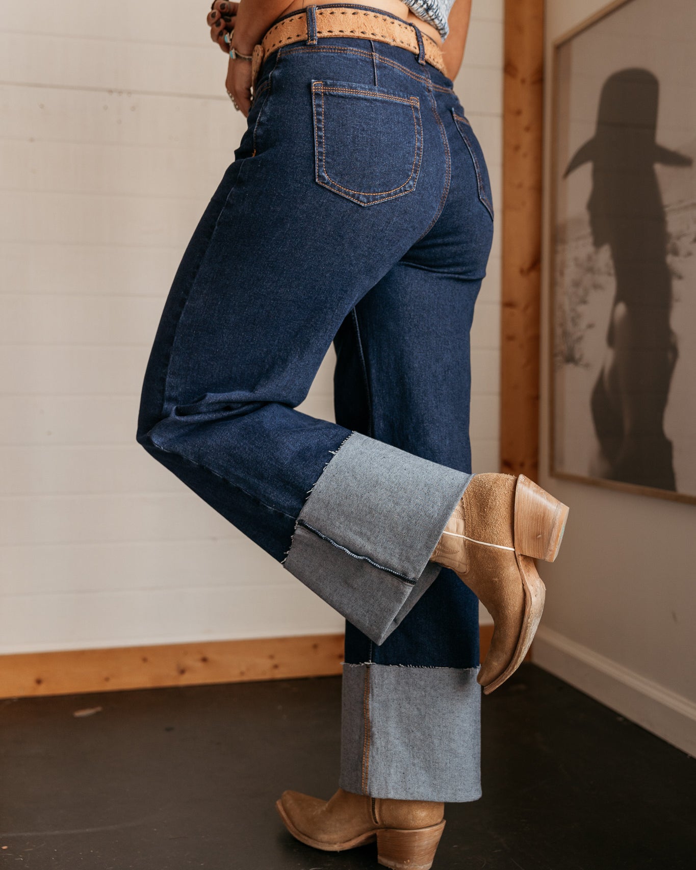 back view of high rise wide leg denim jeans with cuff and back pockets