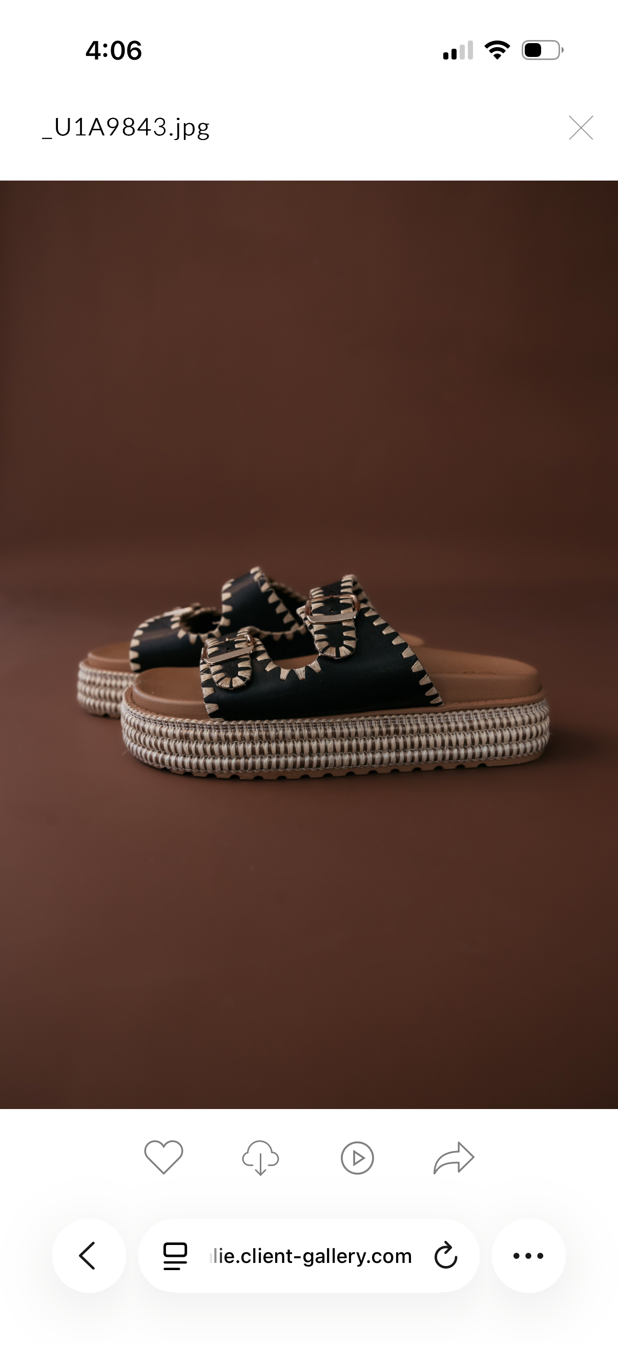 Thunderbird pendant chain necklace displayed on wooden slab with serape fabric underneath - The Wild J