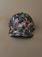 Camo print western cap with pink horse bit embroidery, perfect for cowgirl and rodeo outfits