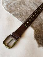 Thunderbird pendant chain necklace displayed on wooden slab with serape fabric underneath - The Wild J