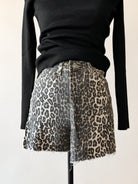 Thunderbird pendant chain necklace displayed on wooden slab with serape fabric underneath - The Wild J