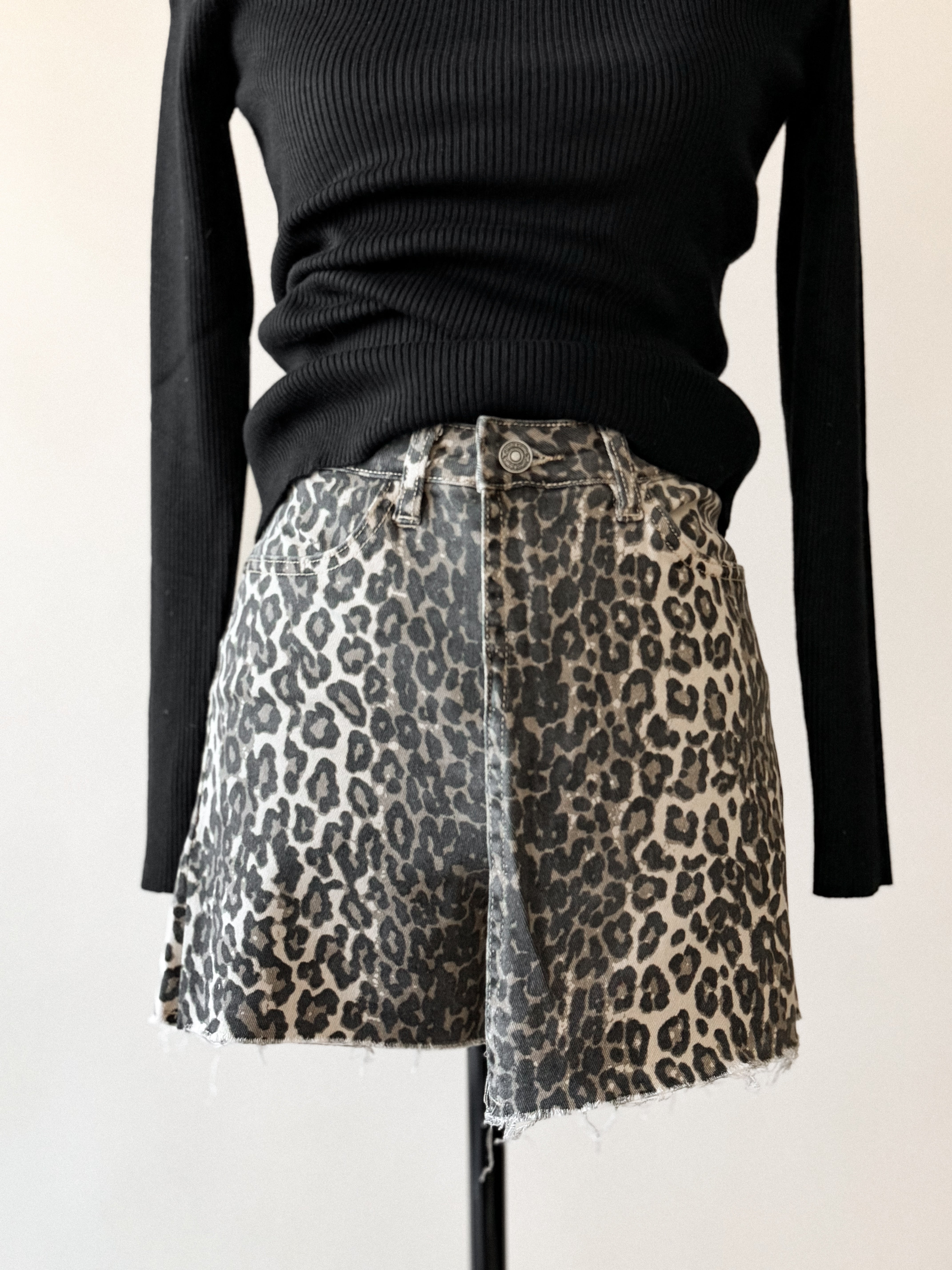 Thunderbird pendant chain necklace displayed on wooden slab with serape fabric underneath - The Wild J