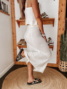 Thunderbird pendant chain necklace displayed on wooden slab with serape fabric underneath - The Wild J