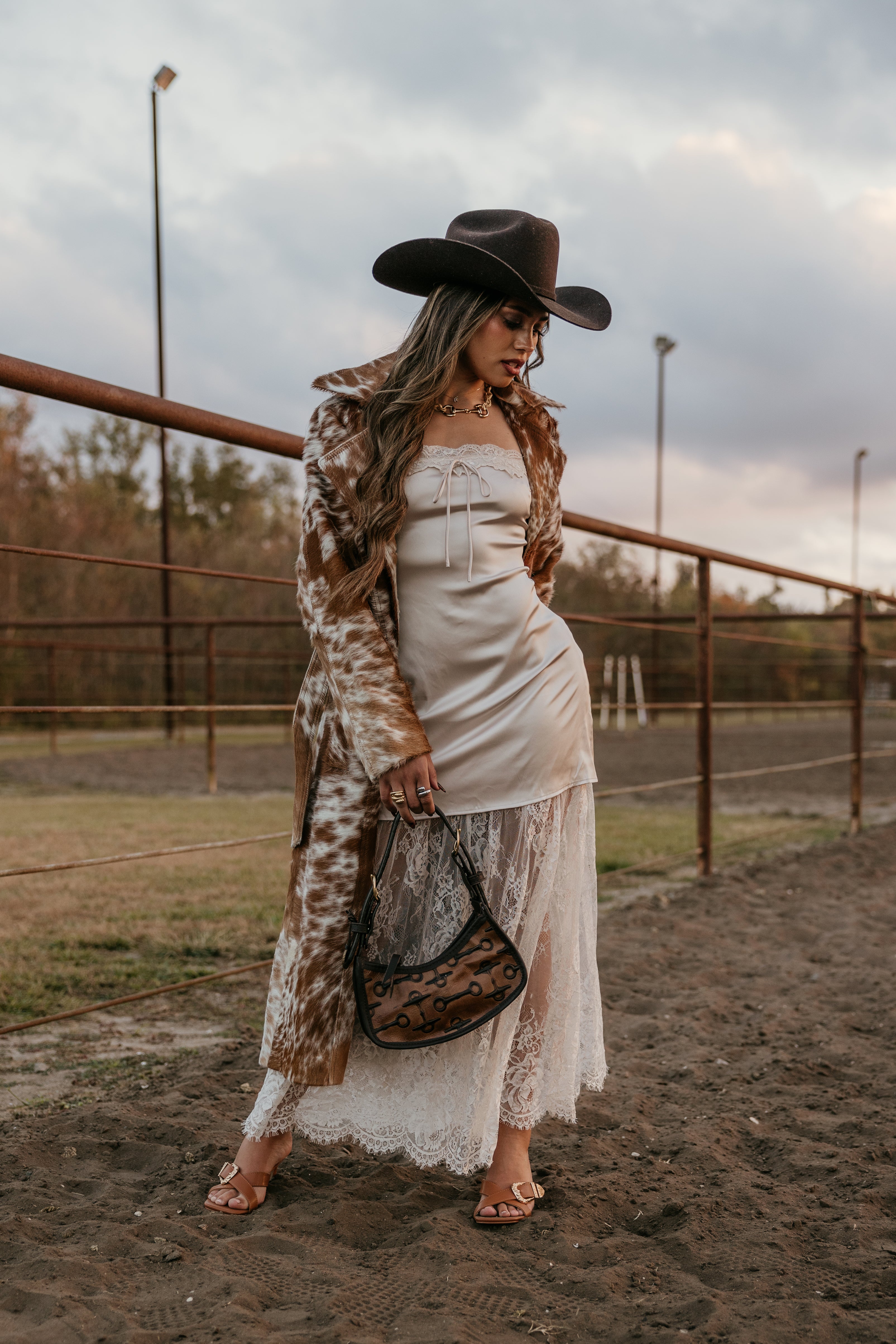 Thunderbird pendant chain necklace displayed on wooden slab with serape fabric underneath - The Wild J