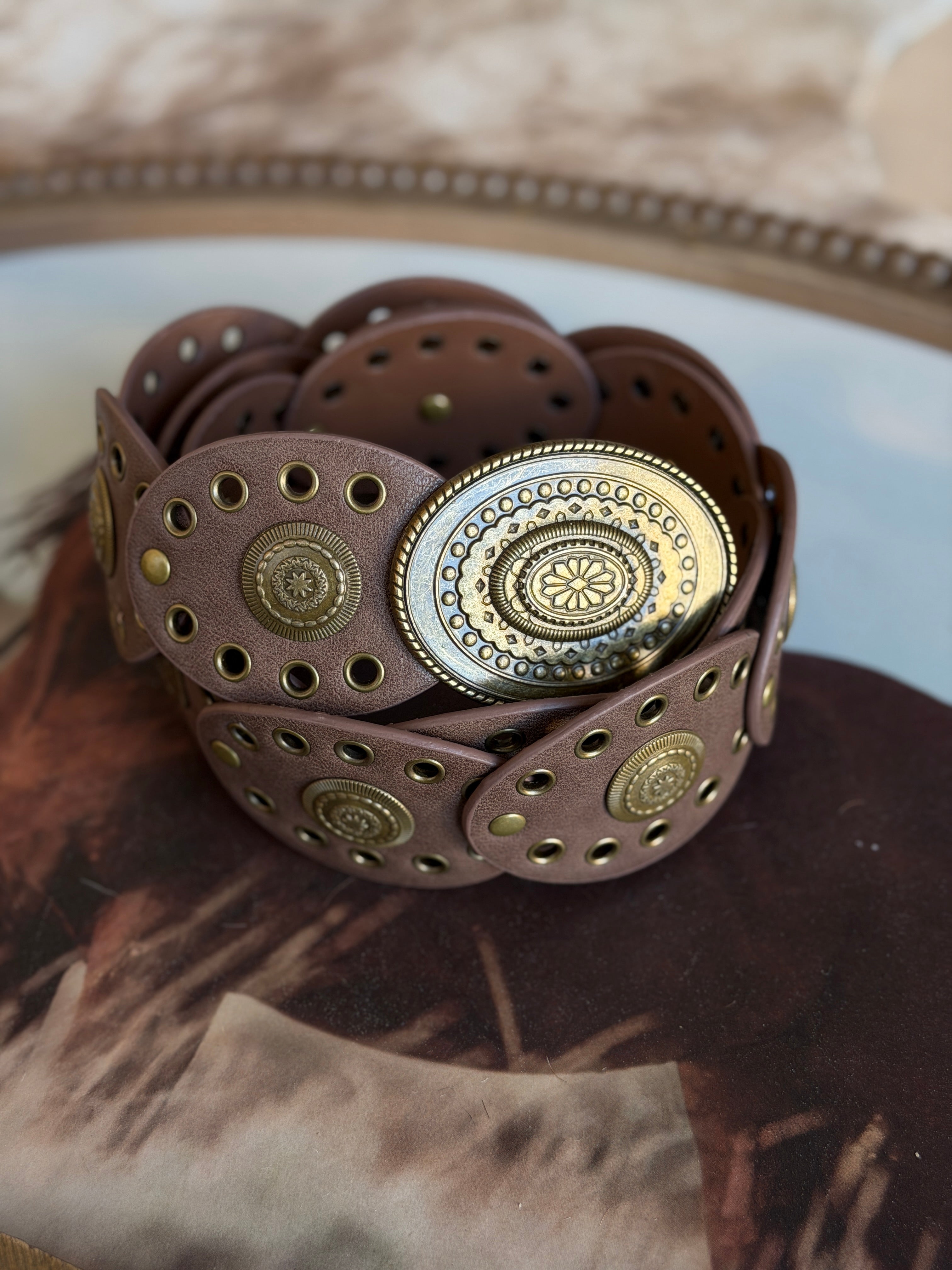 Thunderbird pendant chain necklace displayed on wooden slab with serape fabric underneath - The Wild J