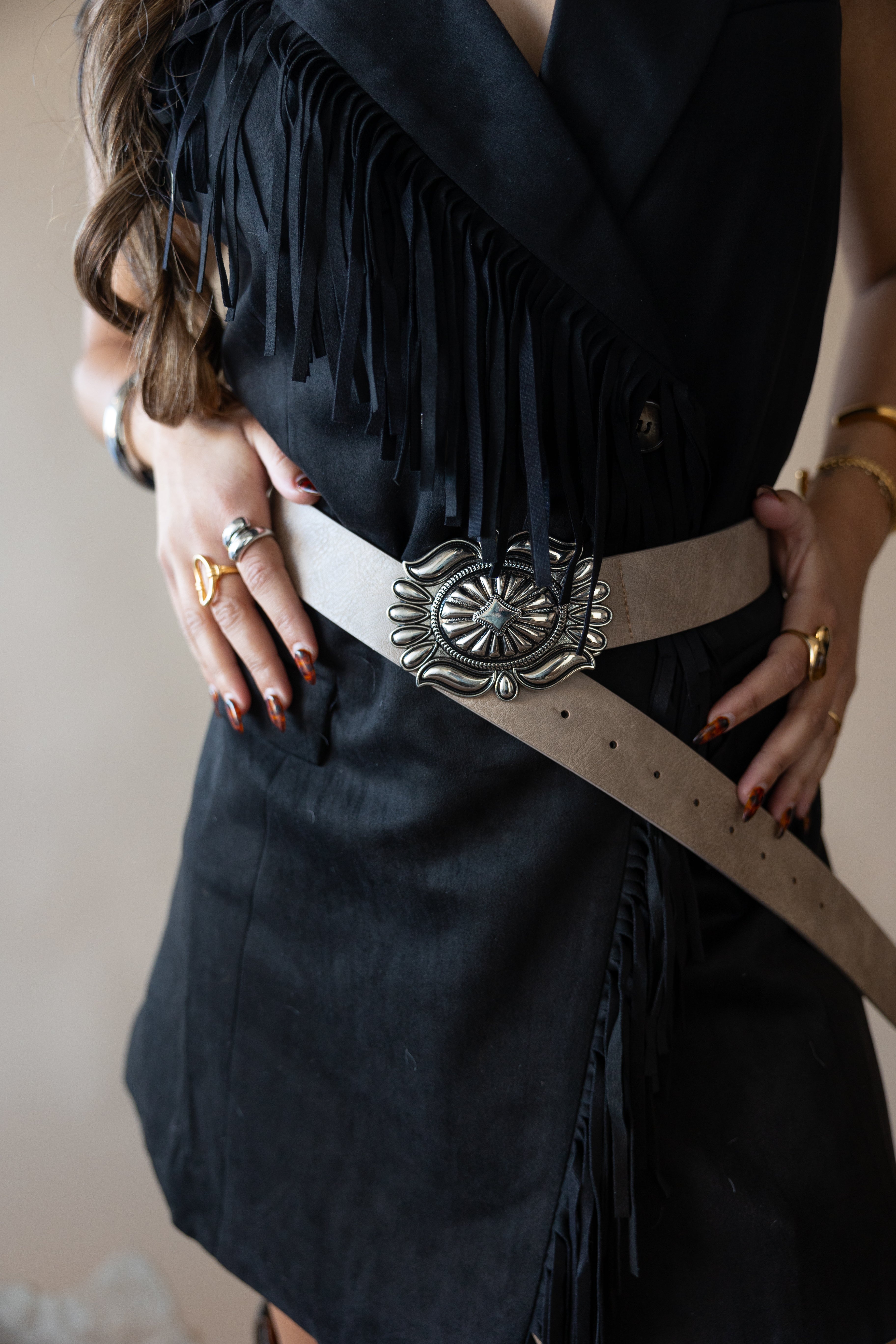 Thunderbird pendant chain necklace displayed on wooden slab with serape fabric underneath - The Wild J
