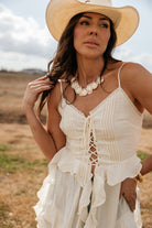 Thunderbird pendant chain necklace displayed on wooden slab with serape fabric underneath - The Wild J