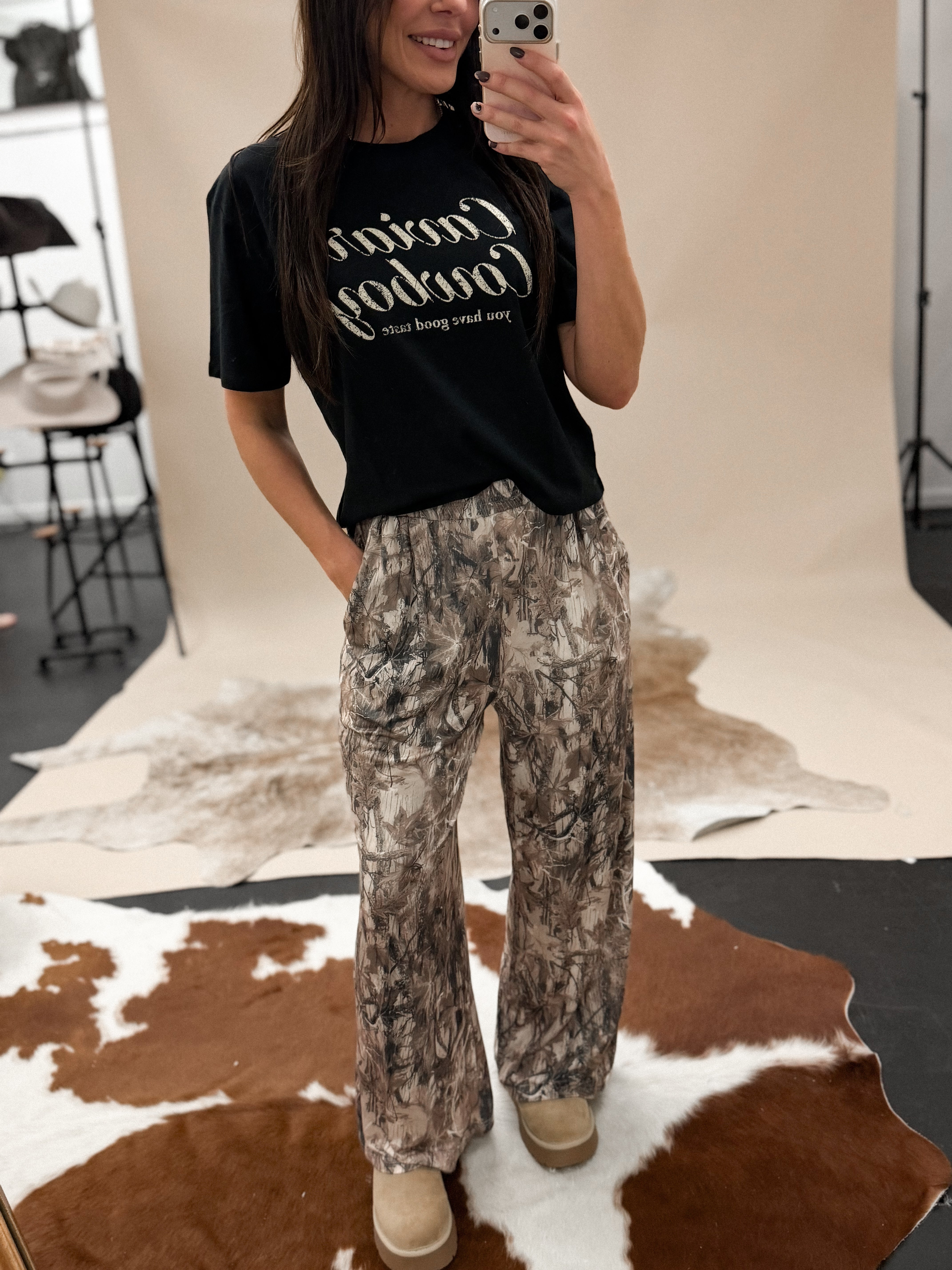 Thunderbird pendant chain necklace displayed on wooden slab with serape fabric underneath - The Wild J