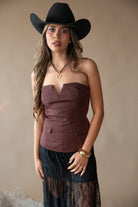 Thunderbird pendant chain necklace displayed on wooden slab with serape fabric underneath - The Wild J