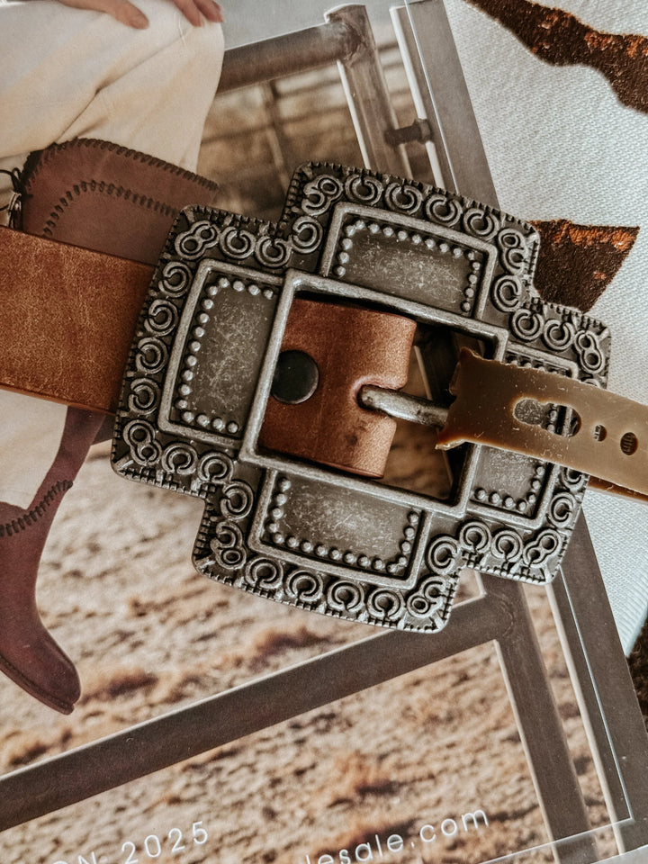 Western boho brown leather belt with ornate silver buckle, cowgirl style accessory