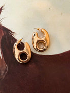 Thunderbird pendant chain necklace displayed on wooden slab with serape fabric underneath - The Wild J