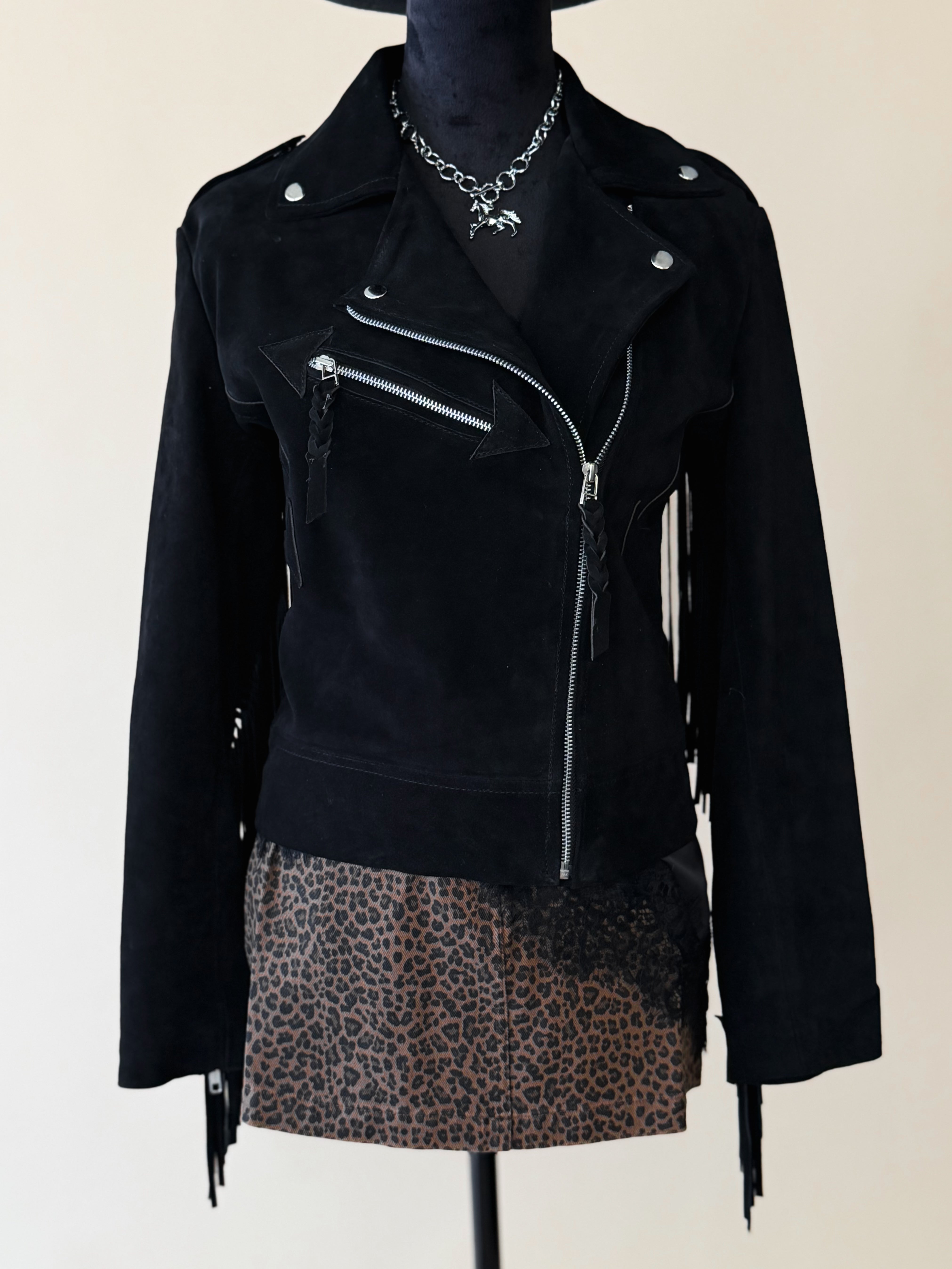 Black suede western fringe jacket with zipper and leopard print skirt, boho cowgirl style